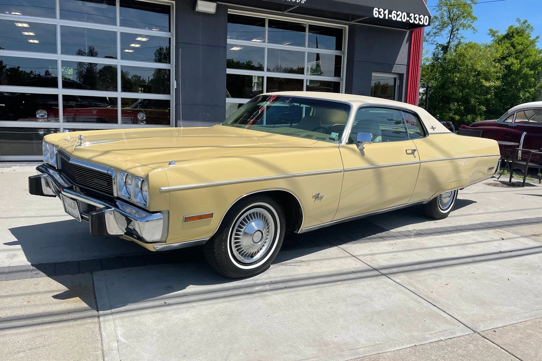 Left front view of a Honey Gold 1973 Plymouth Fury Gran Coupe two-door hardtop