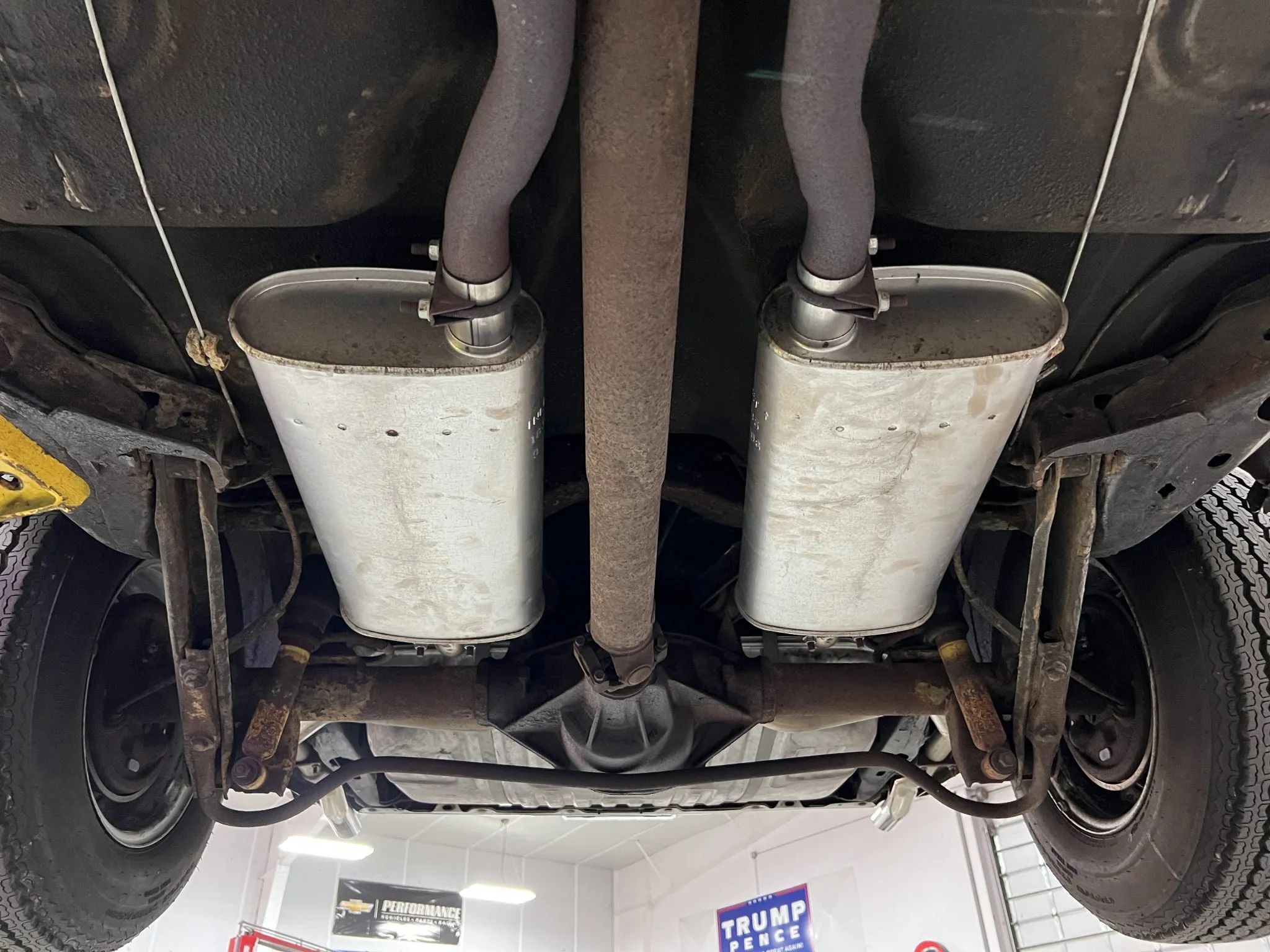 Dual exhausts and rear axle of a 1973 Grand Am, seen from below