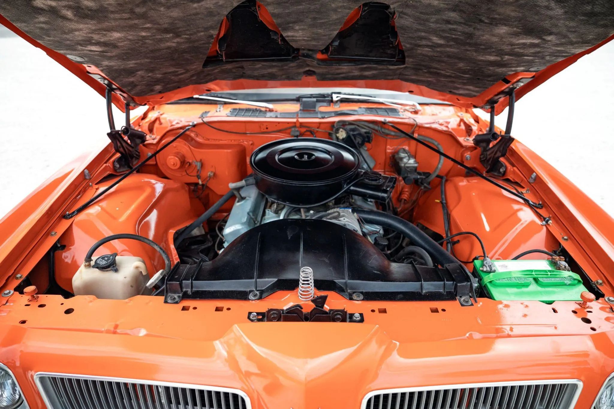 1973 Pontiac LeMans Sport Coupe: The Poor Man's GTO, With A 3-Speed Manual Transmission 10 Engine in an orange 1973 Pontiac LeMans