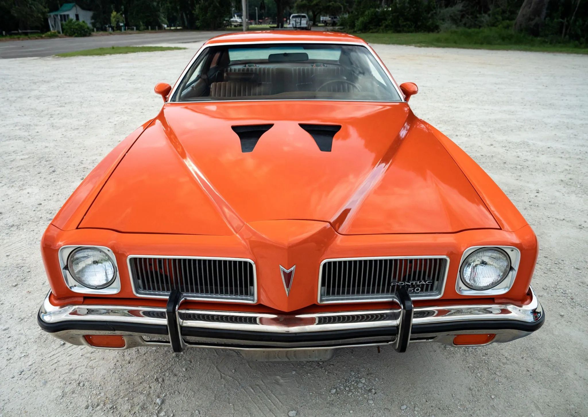 1973 Pontiac LeMans Sport Coupe: The Poor Man's GTO, With A 3-Speed Manual Transmission 9 High-angle front view of an orange 1973 Pontiac