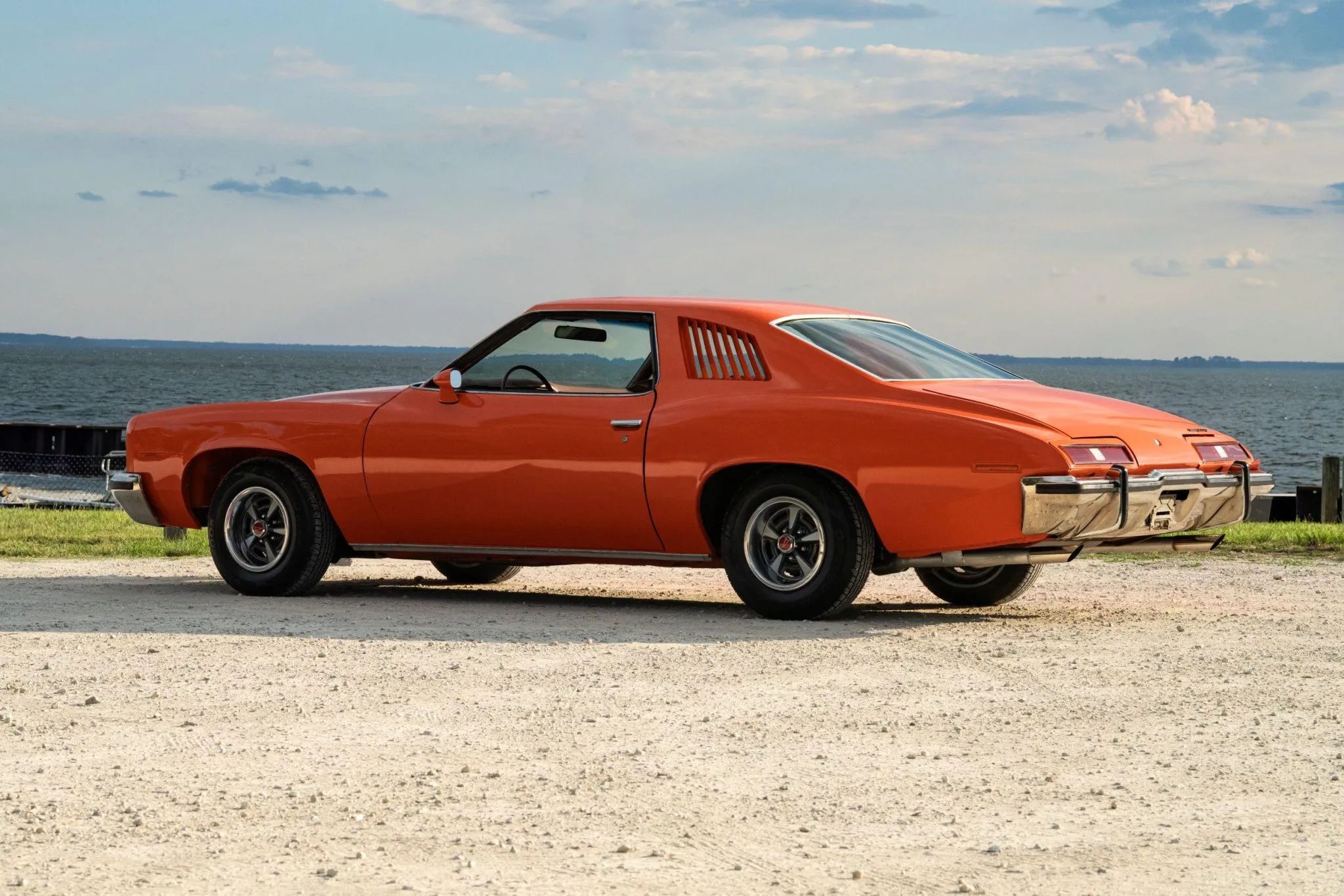 1973 Pontiac LeMans Sport Coupe: The Poor Man's GTO, With A 3-Speed Manual Transmission 12 Left rear 3q view of an orange 1973 Pontiac Colonnade coupe