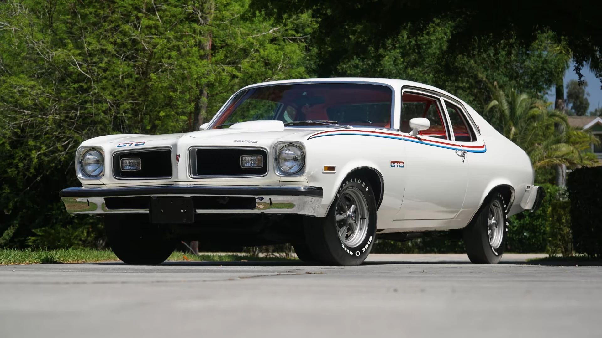 1974 Pontiac LeMans GT 350 4-Speed: The GTO's Understudy Takes The Stage 3 Low-angle left front 3q view of a white 1974 Ventura coupe with red and blue stripes