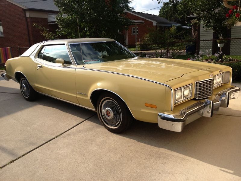 Ford's Gran Torino Elite and Mercury's Cougar XR-7: Ford Undercuts Mercury Again For 1974 2 Tan 1974 Mercury Montego MX Brougham from passenger front three-quarter view
