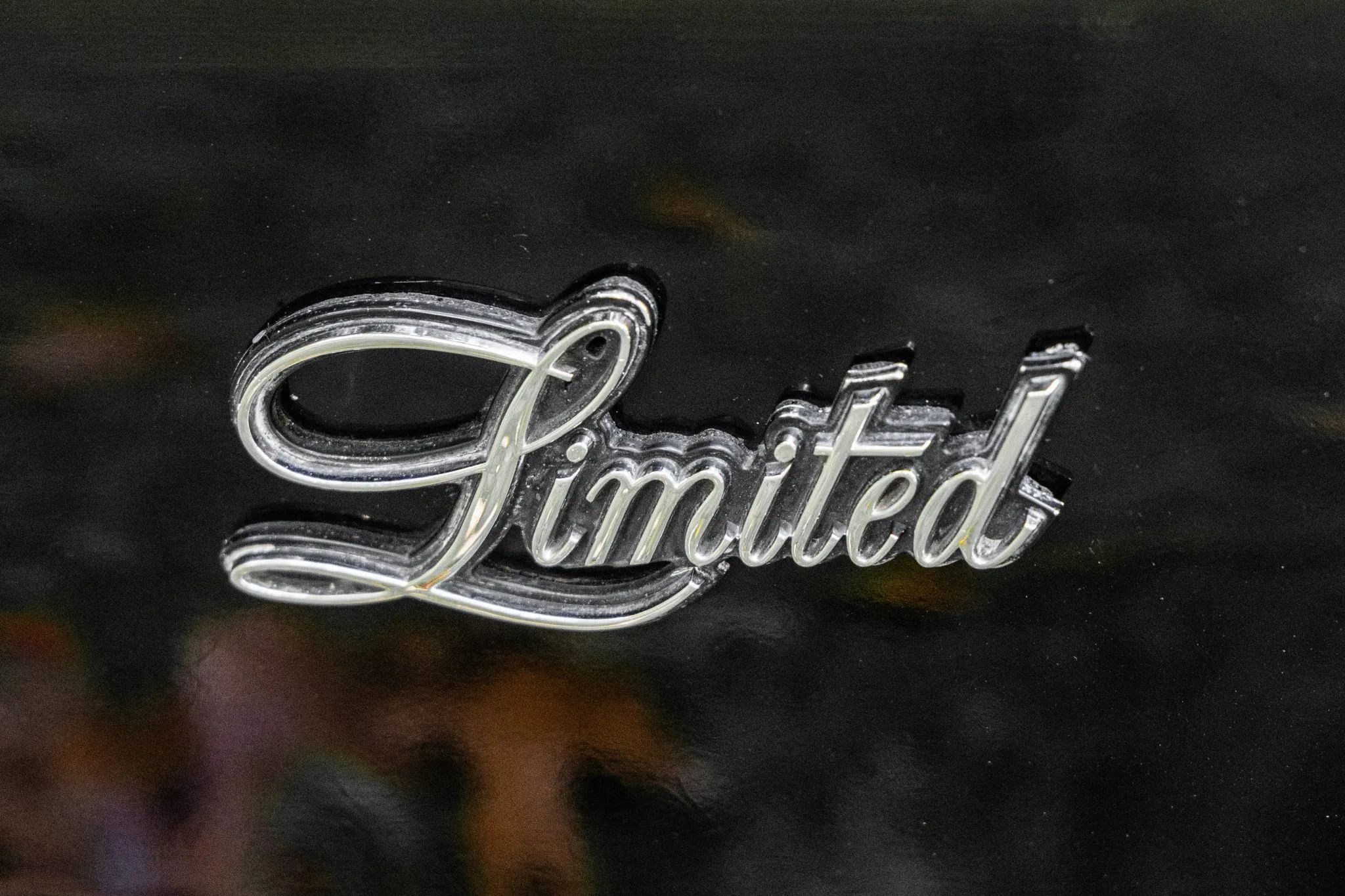 "Limited" badge on a black car