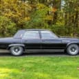 Take one full-size American near-luxury car, lop a foot off its overall length, subtract over 100 cubic inches of engine displacement, and raise the price by hundreds of dollars. It [&hellip;]