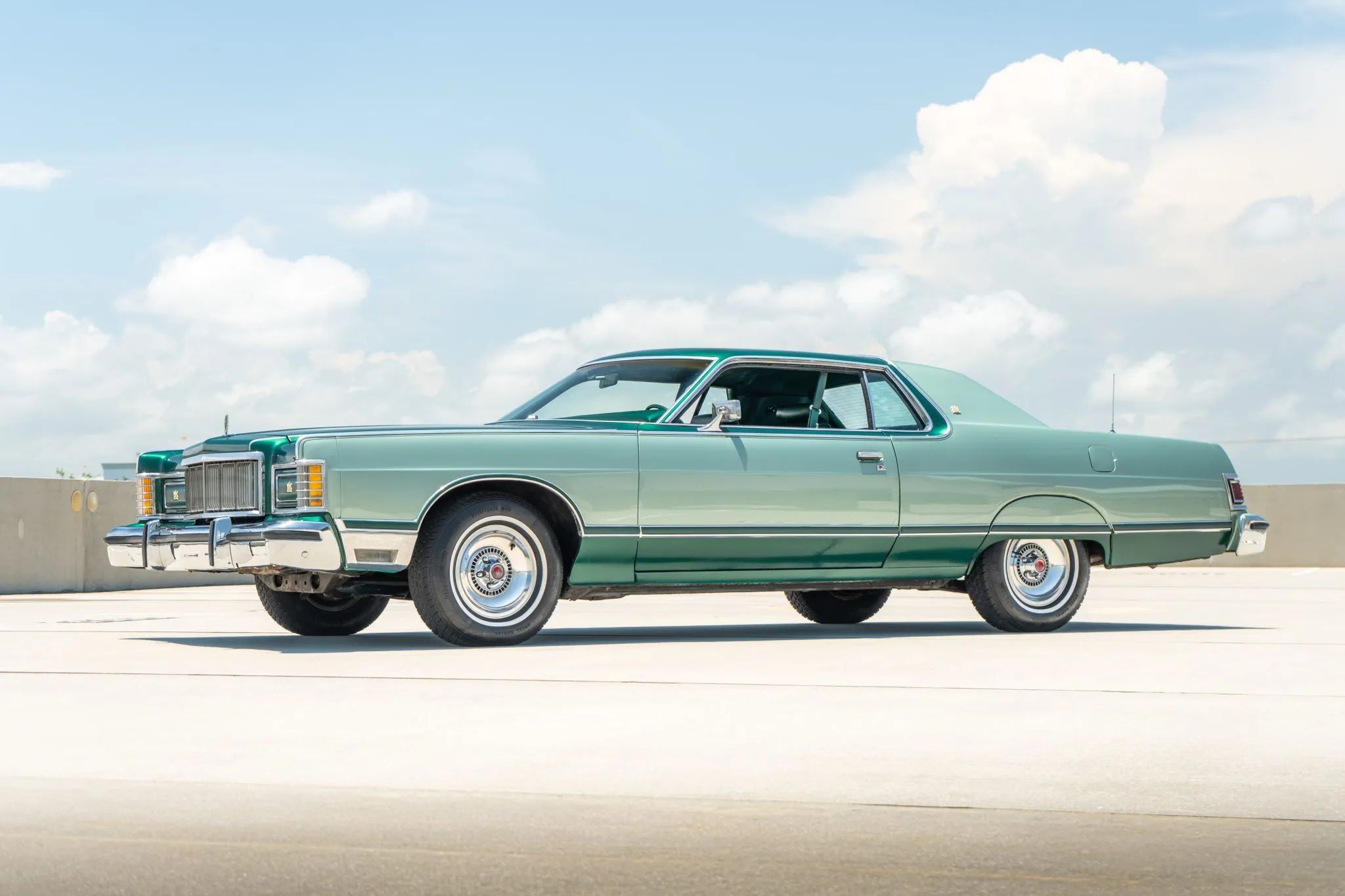 Left front 3q view of a two-tone green 1977 Mercury Grand Marquis two-door hardtop with forged alloy wheels