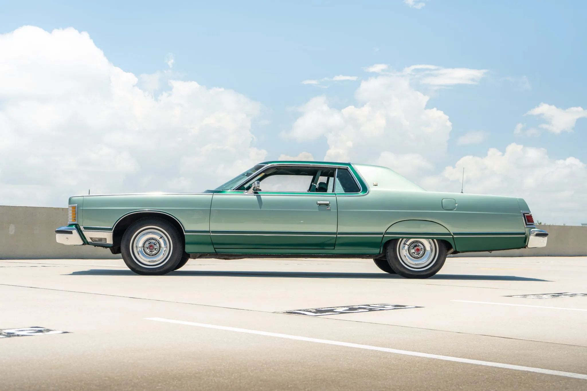 Low-angle left side view of a 1977 Grand Marquis