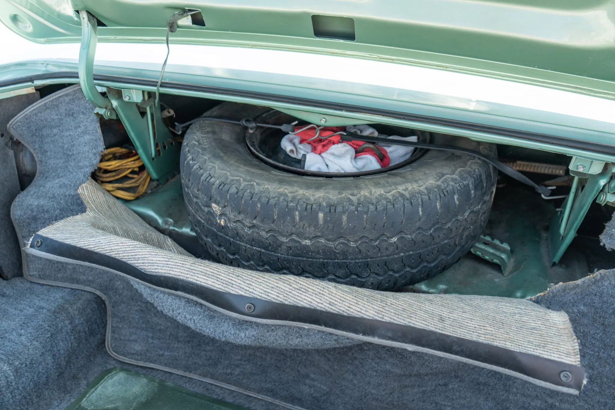 Spare tire in the trunk of a 1977 Mercury Grand Marquis