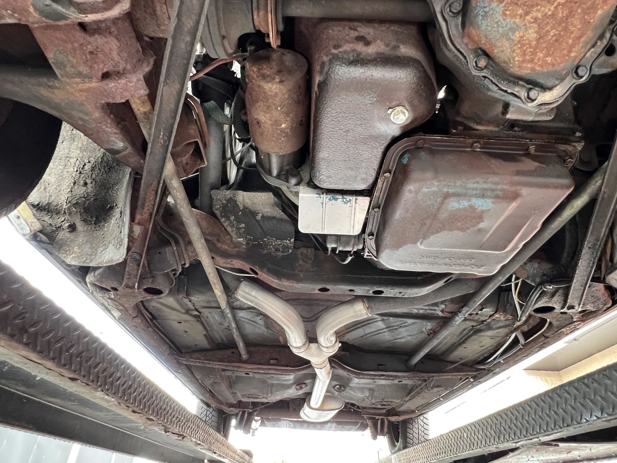 Powertrain of a 1978 Eldorado, seen from below with the car on a hoist