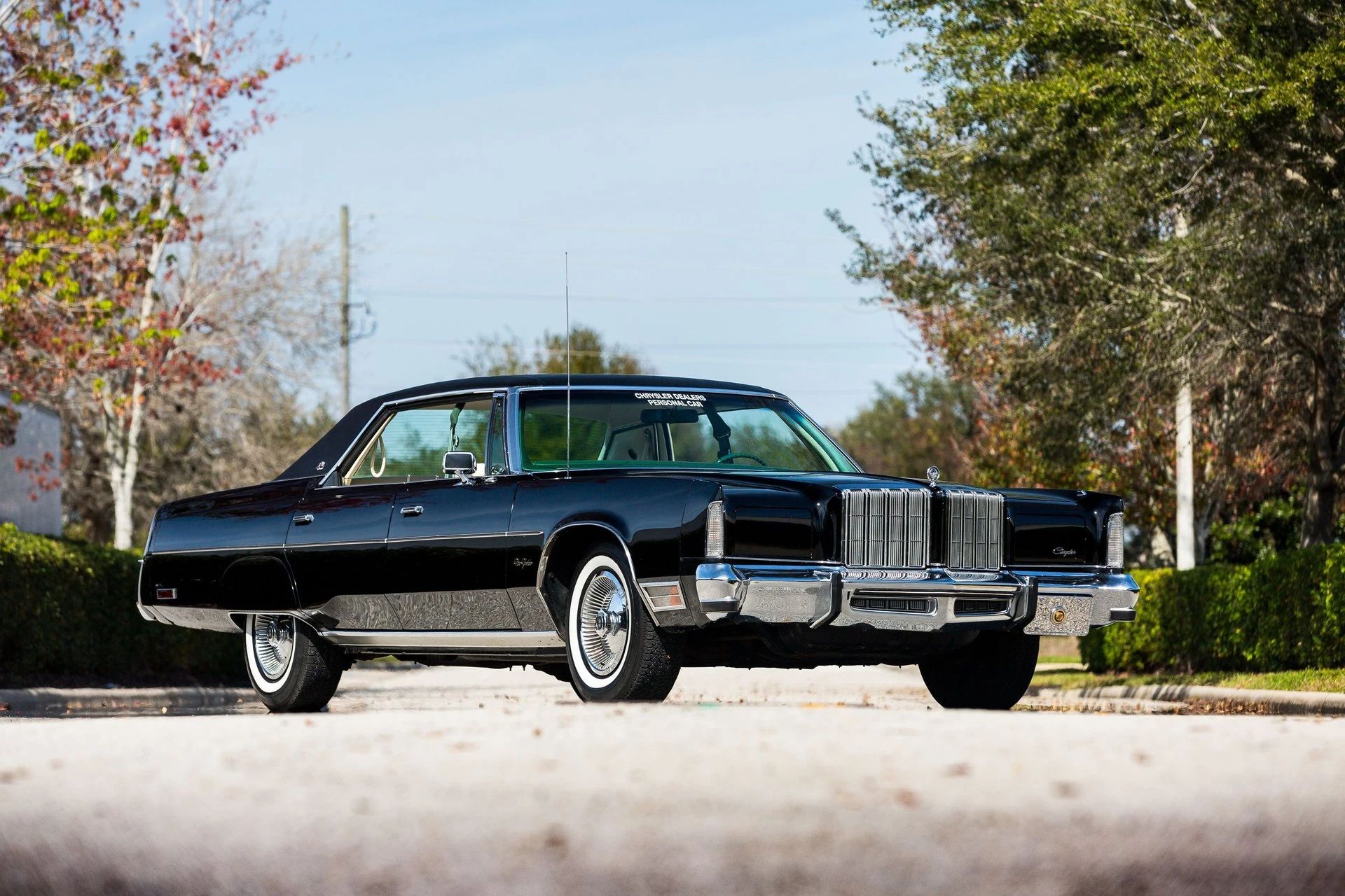 Low-angle front 3q view of a black 1978 Chrysler new Yorker four-door