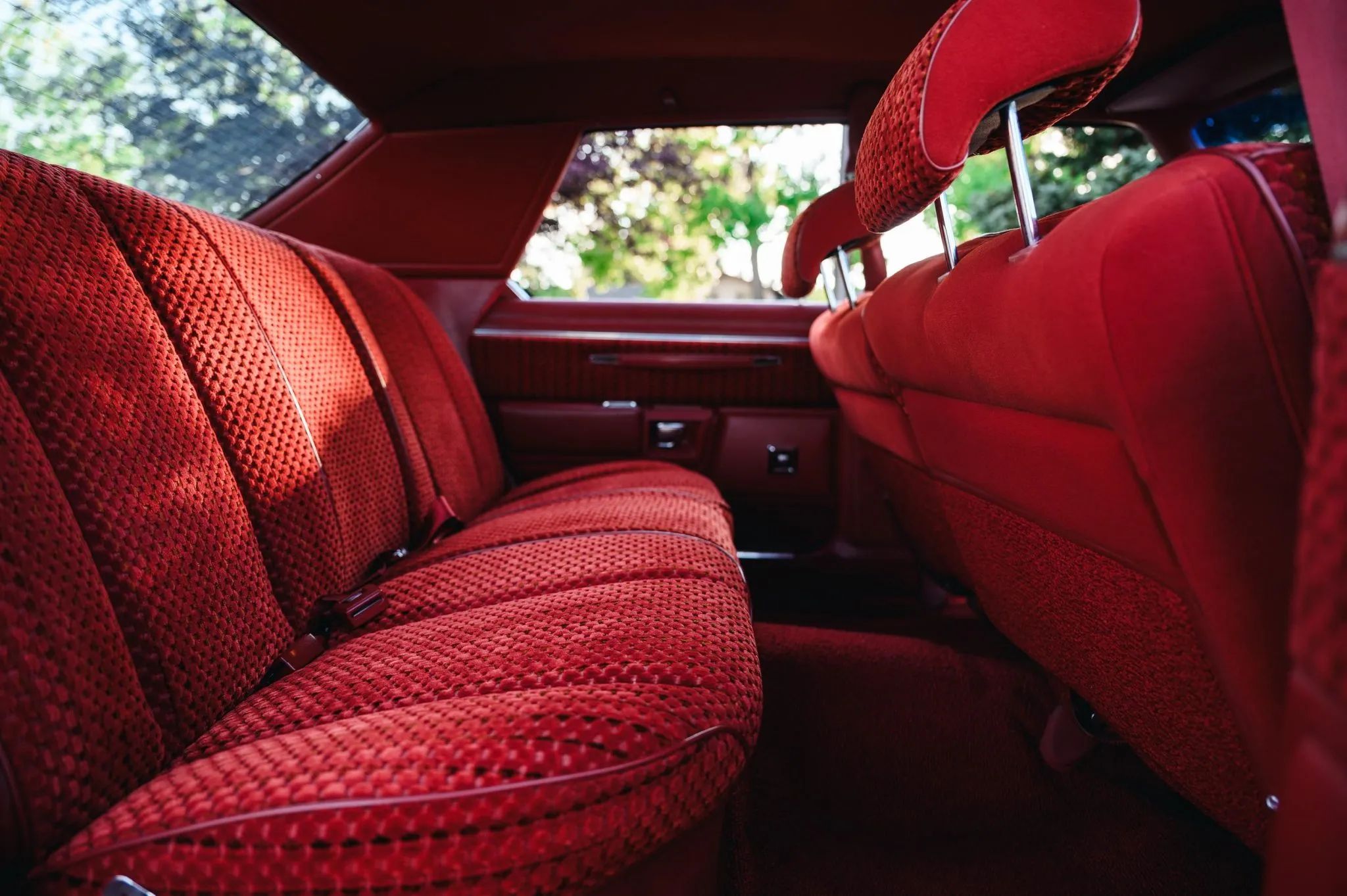 Back seat of a 1978 Chrysler four-door, seen through the right rear door