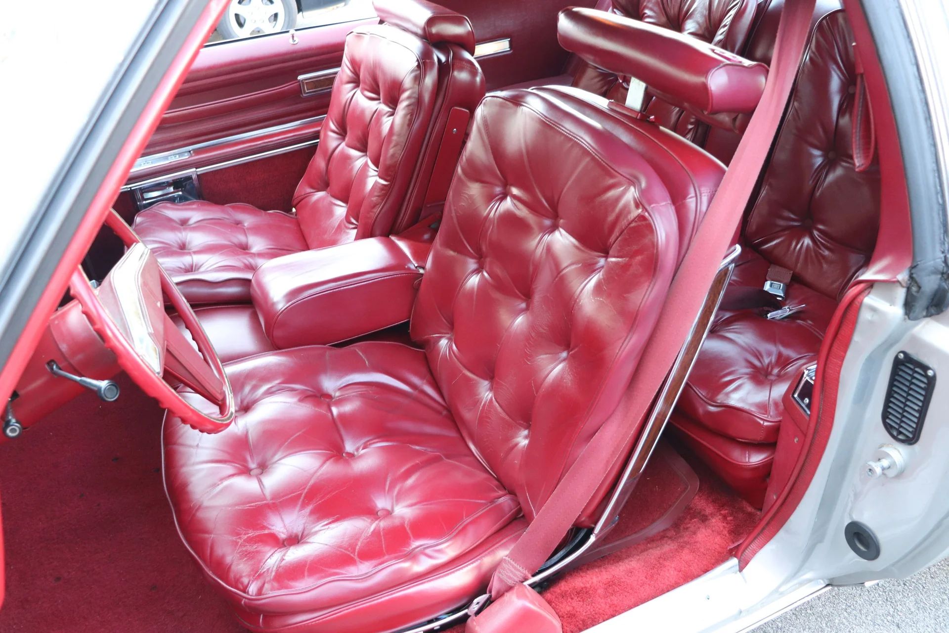 1978 Oldsmobile Toronado XS: Unusual Bent-Glass Special Edition Reinvents The 1947 Studebaker 20 Front seat of a 1978 Toronado, seen from the driver's door