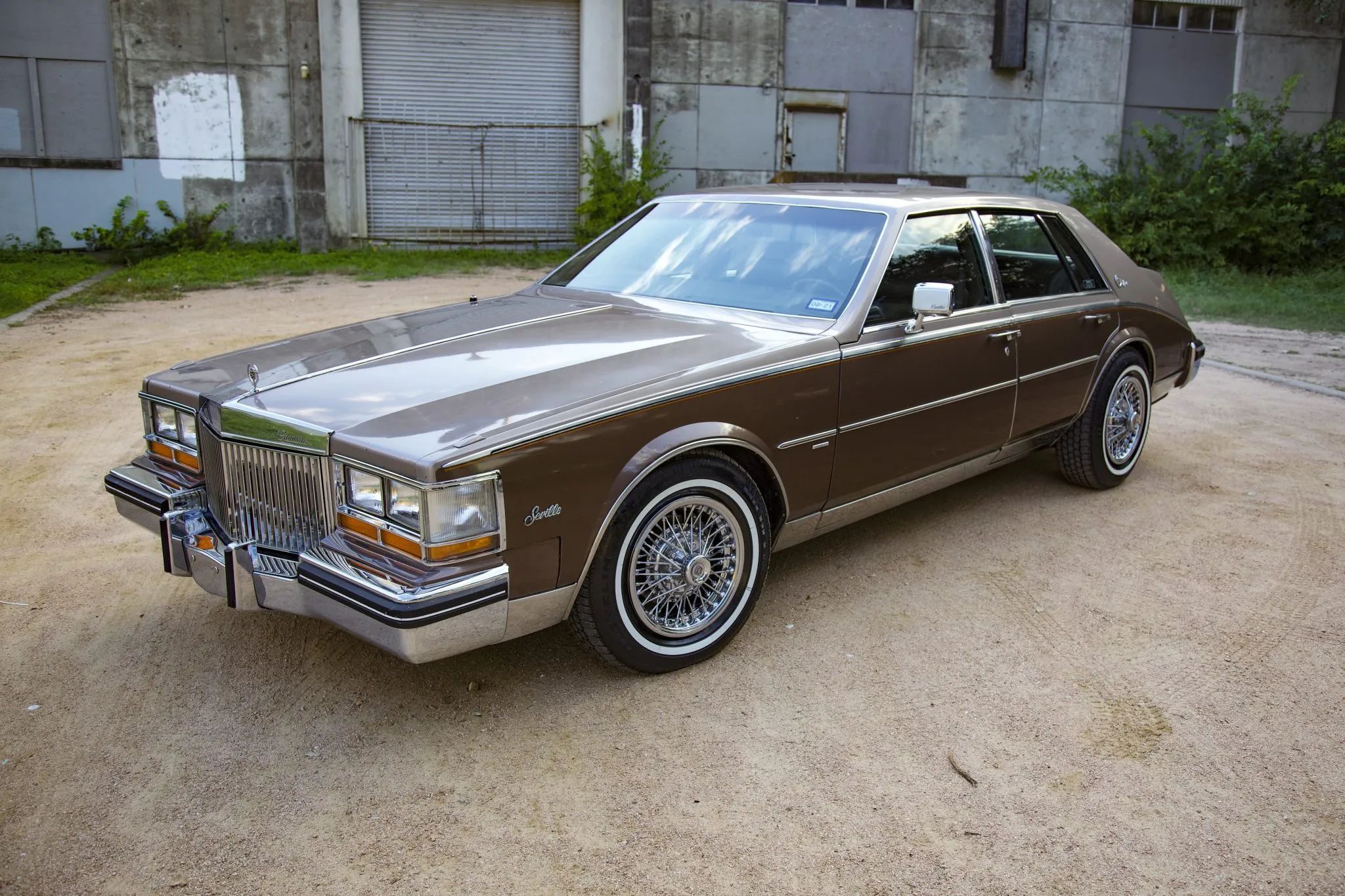 Left front 3q view of a two-tone brown 1982 Cadillac Seville