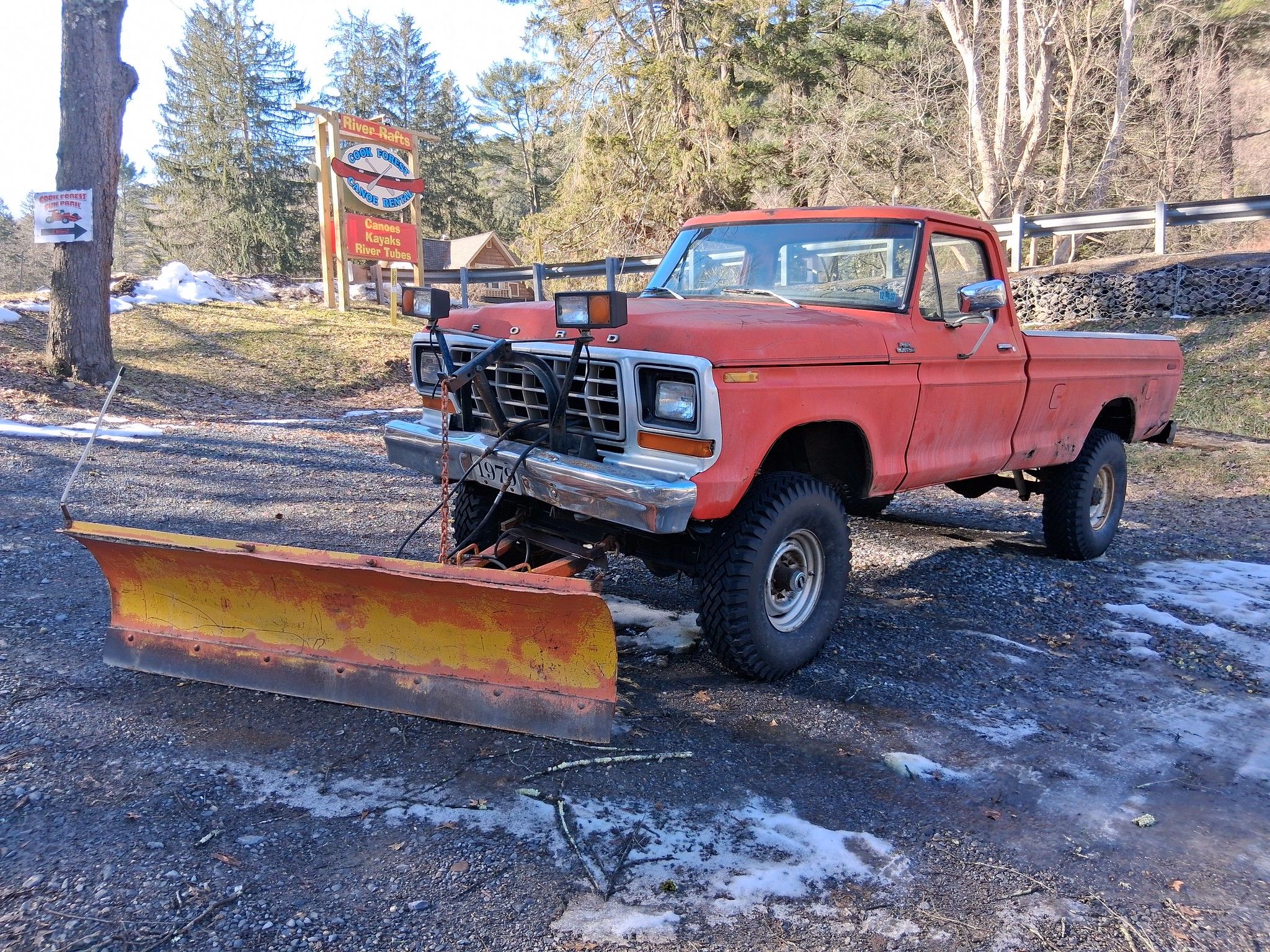 Picture of coral 1979 Ford F-250 4x4 with snow plow on the front