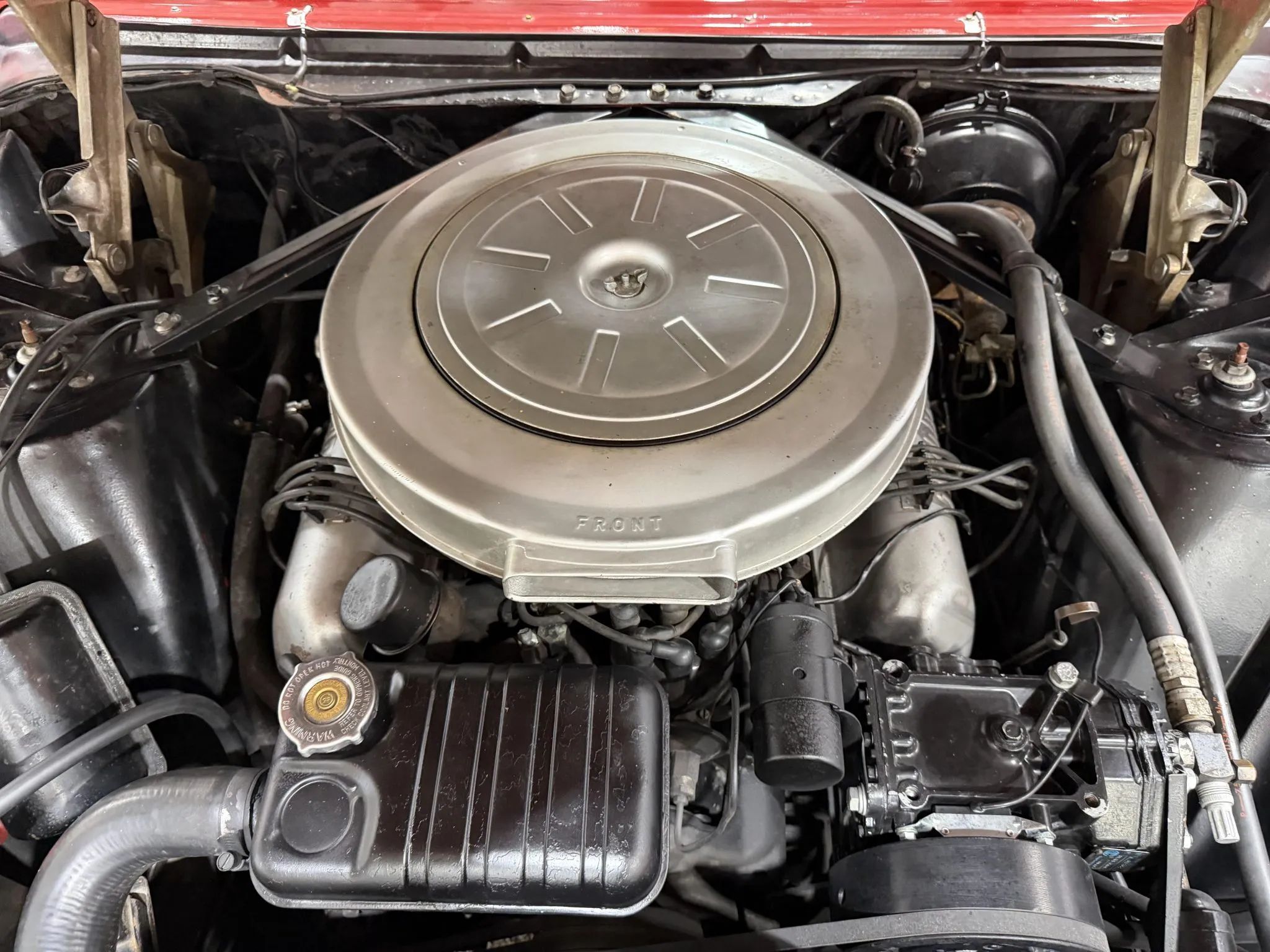 1962 Ford 390 engine with silver valve covers and air cleaner