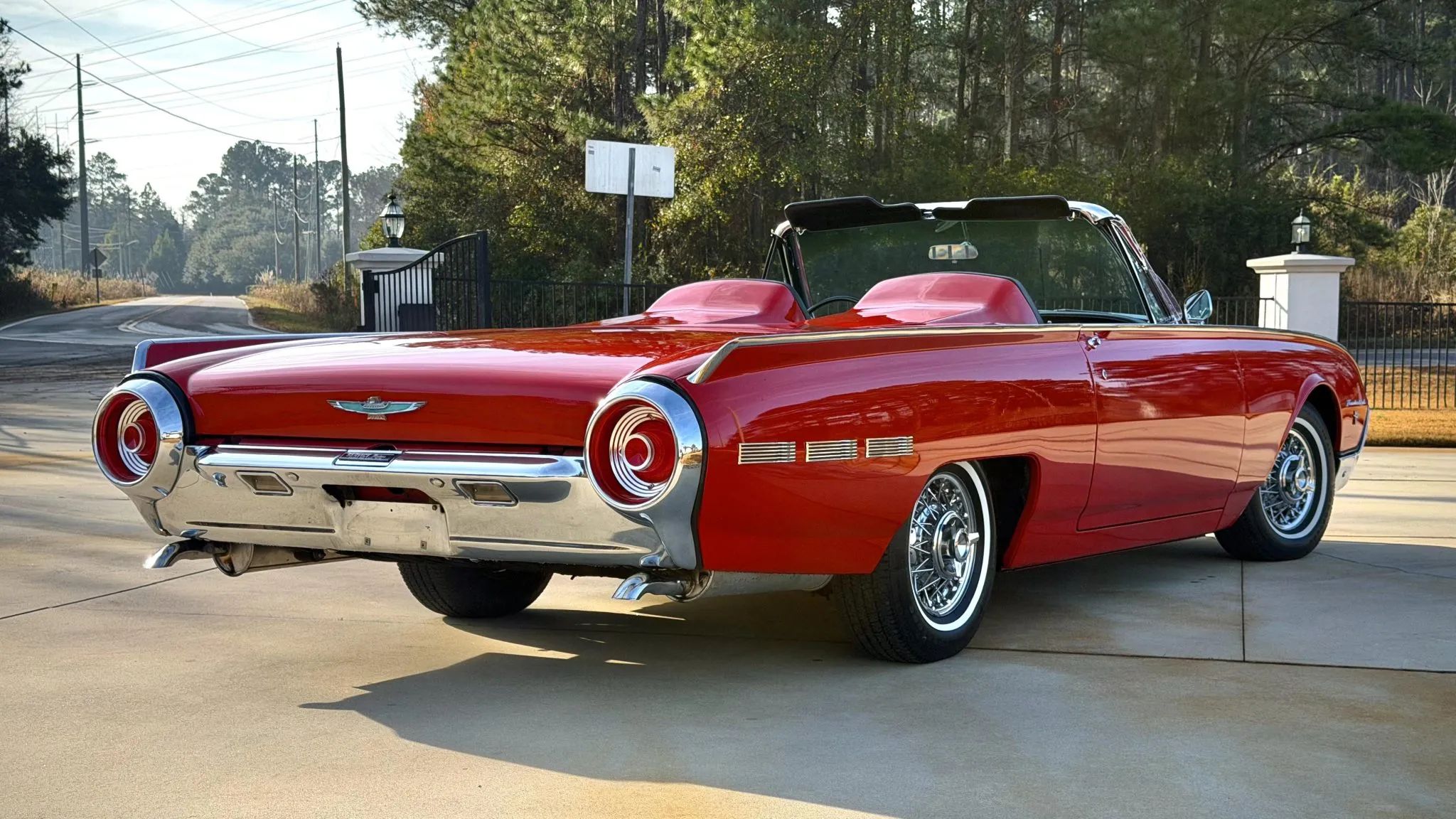 Rangoon Red 1962 Ford Thunderbird Sports Roadster rear three-quarter view with top down