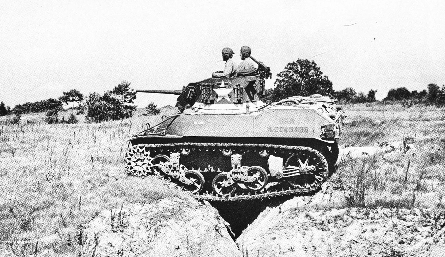This WW2 Tank Is Powered By Twin Cadillac Engines And Hydra-Matic Transmissions, And It Was Parked Down The Street 27 B&W photo of an early M5 crossing a crevice