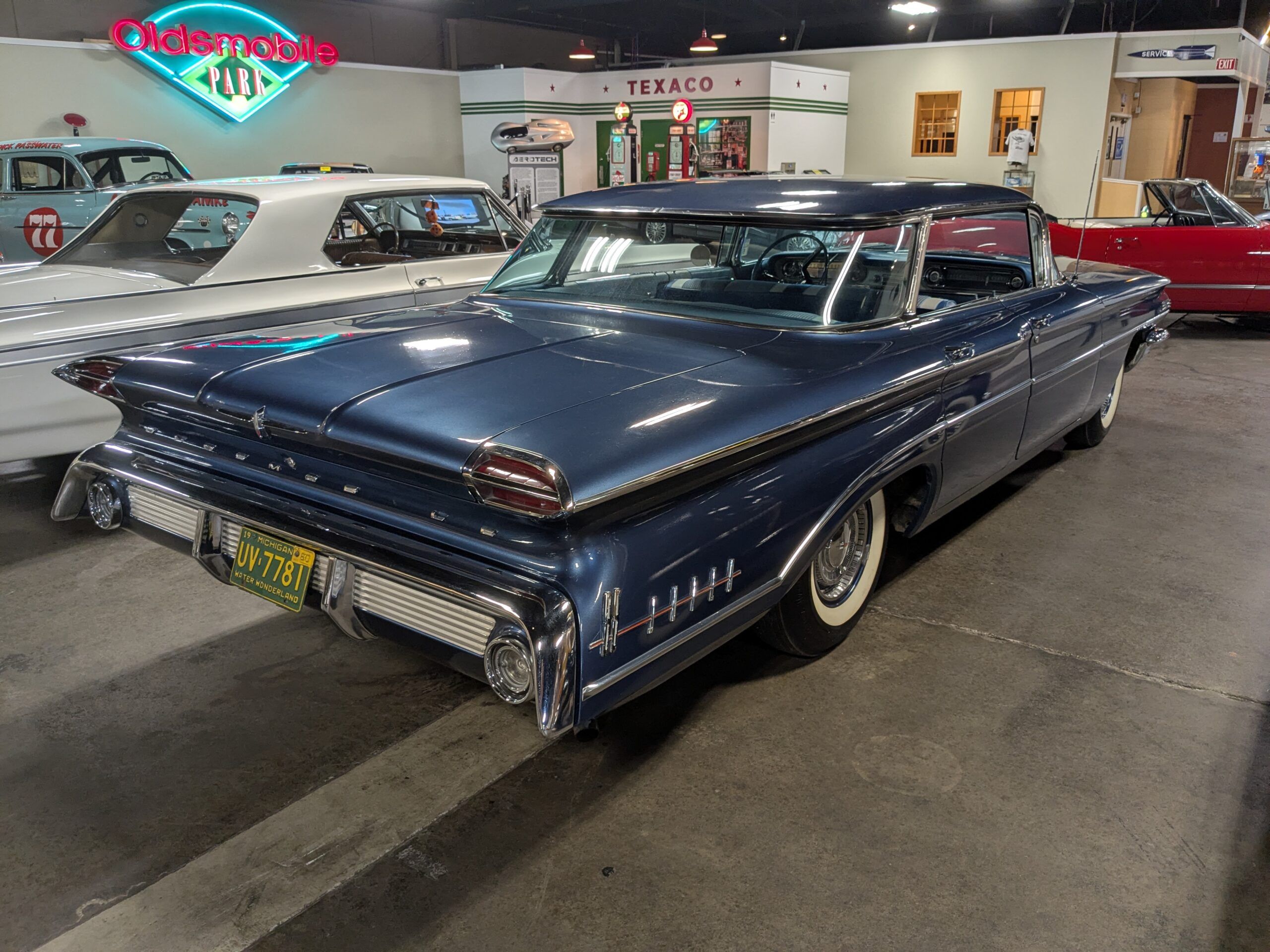 Passenger rear three-quarter view of blue 1960 Oldsmobile Super 88