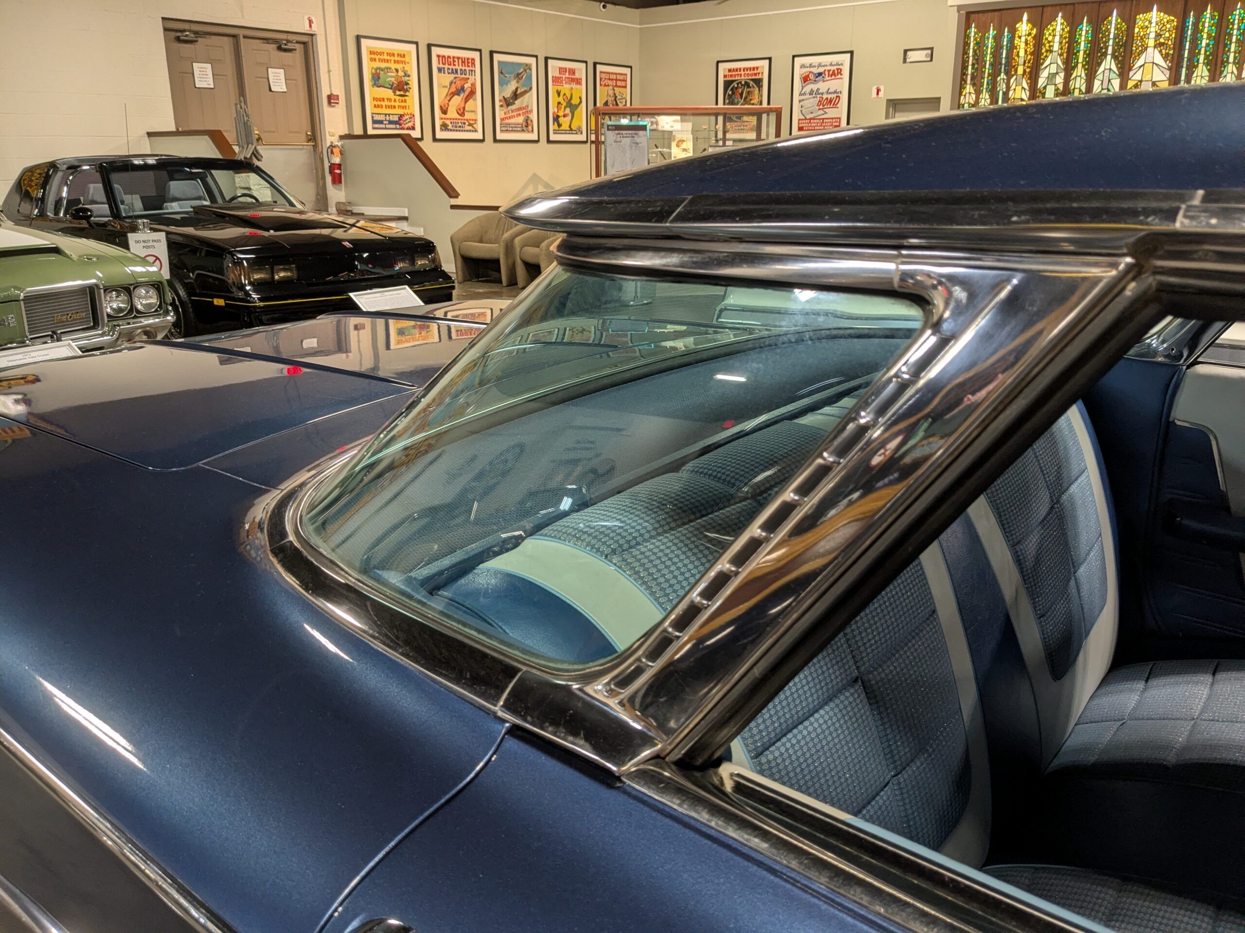 Wraparound rear window of blue 1960 Oldsmobile Super 88