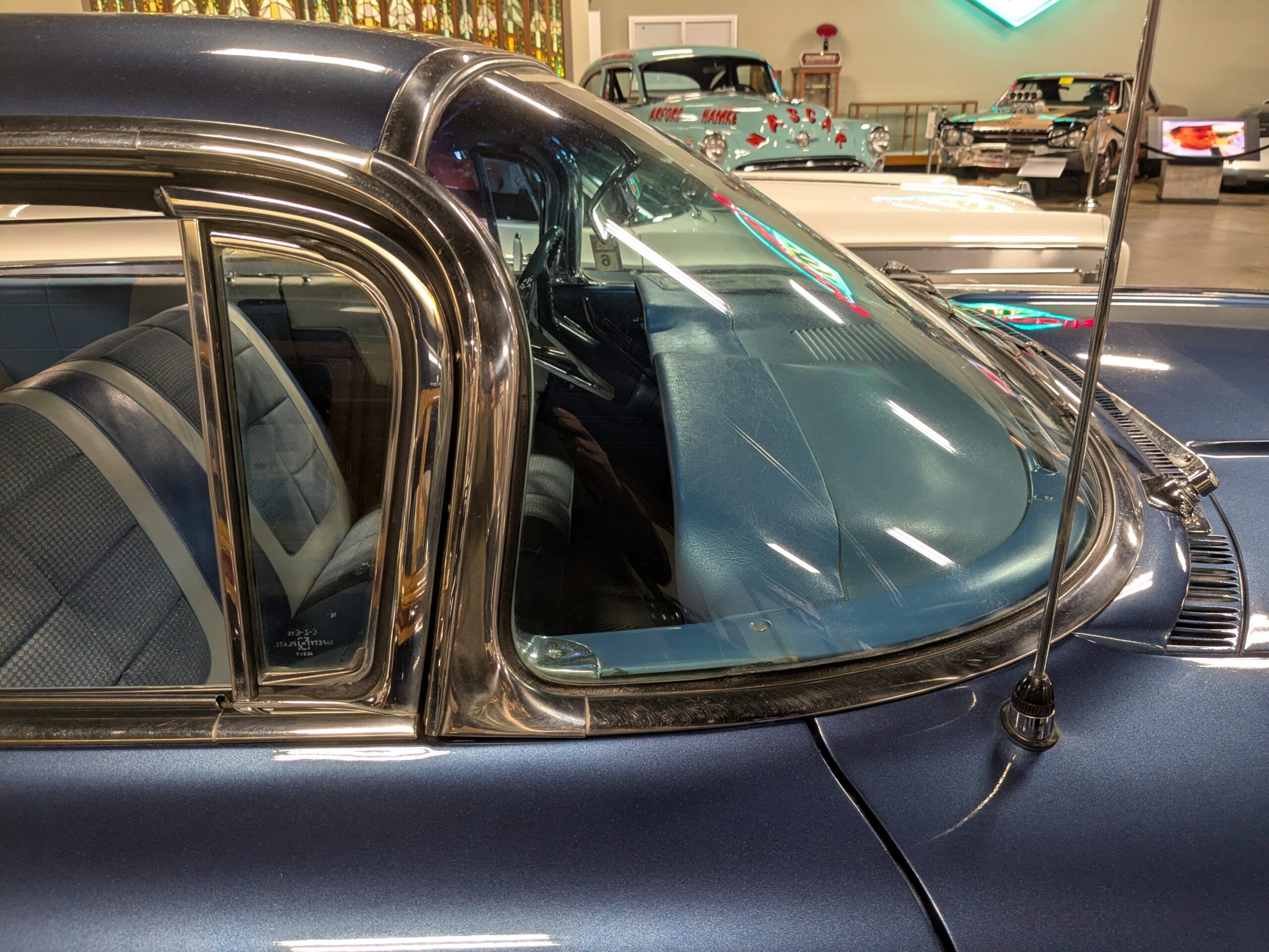 Wraparound windshield of blue 1960 Oldsmobile Super 88