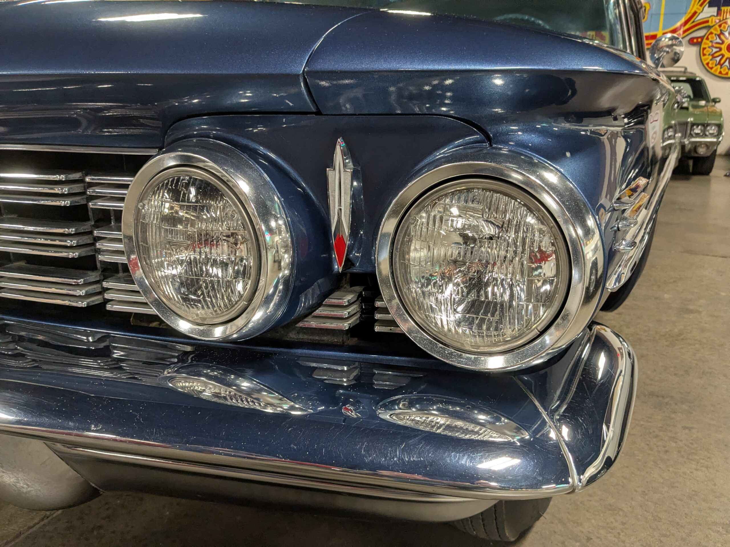 Headlights and grille of blue 1960 Oldsmobile Super 88