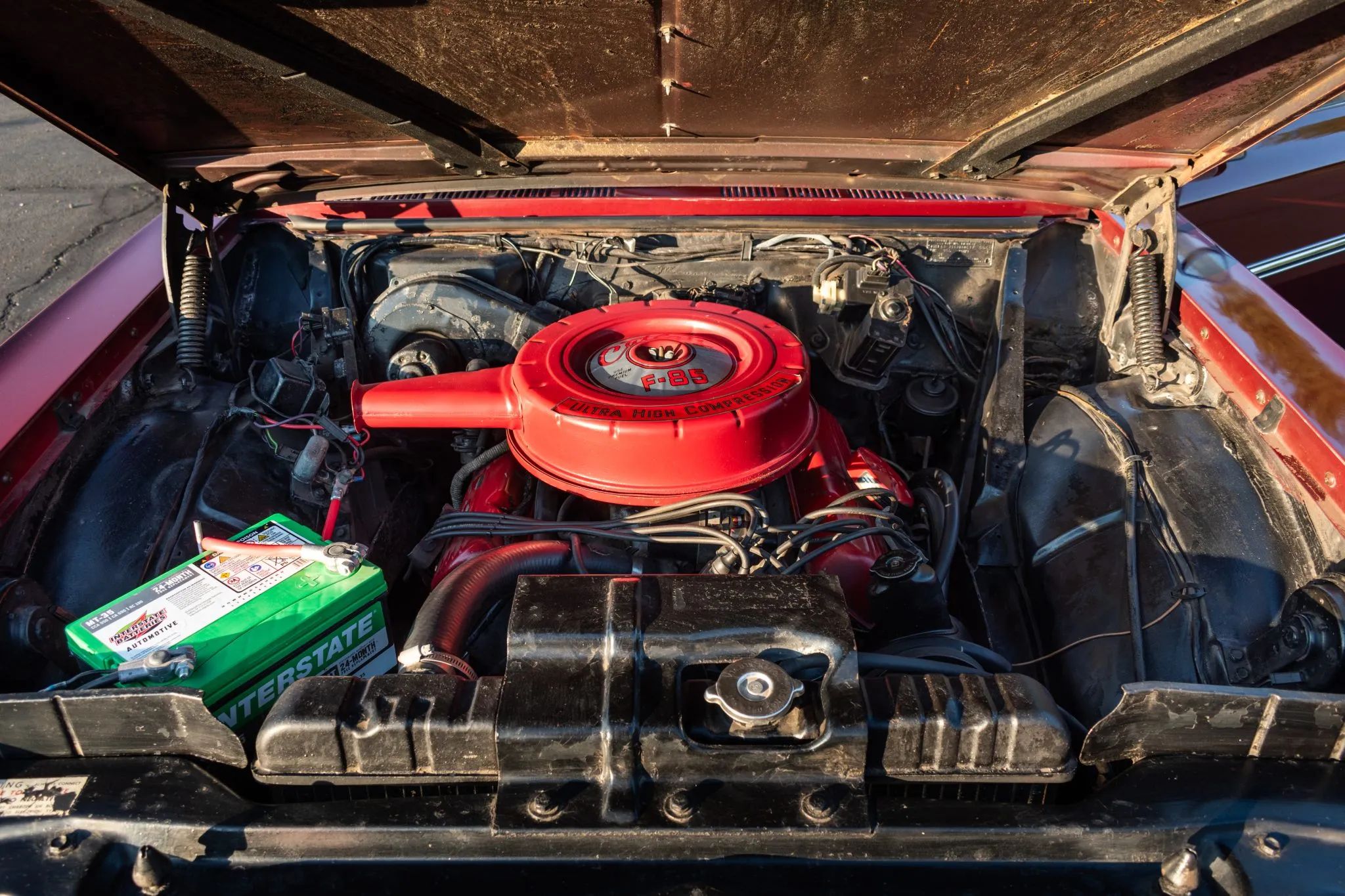 1963 Oldsmobile F-85 Cutlass Convertible With Aluminum V-8 And 4-Speed: Not Quite A 4-4-2 7 Engine in a 1963 Olds Cutlass, with an air cleaner decal reading "Cutlass F-85 Ultra High Compression"