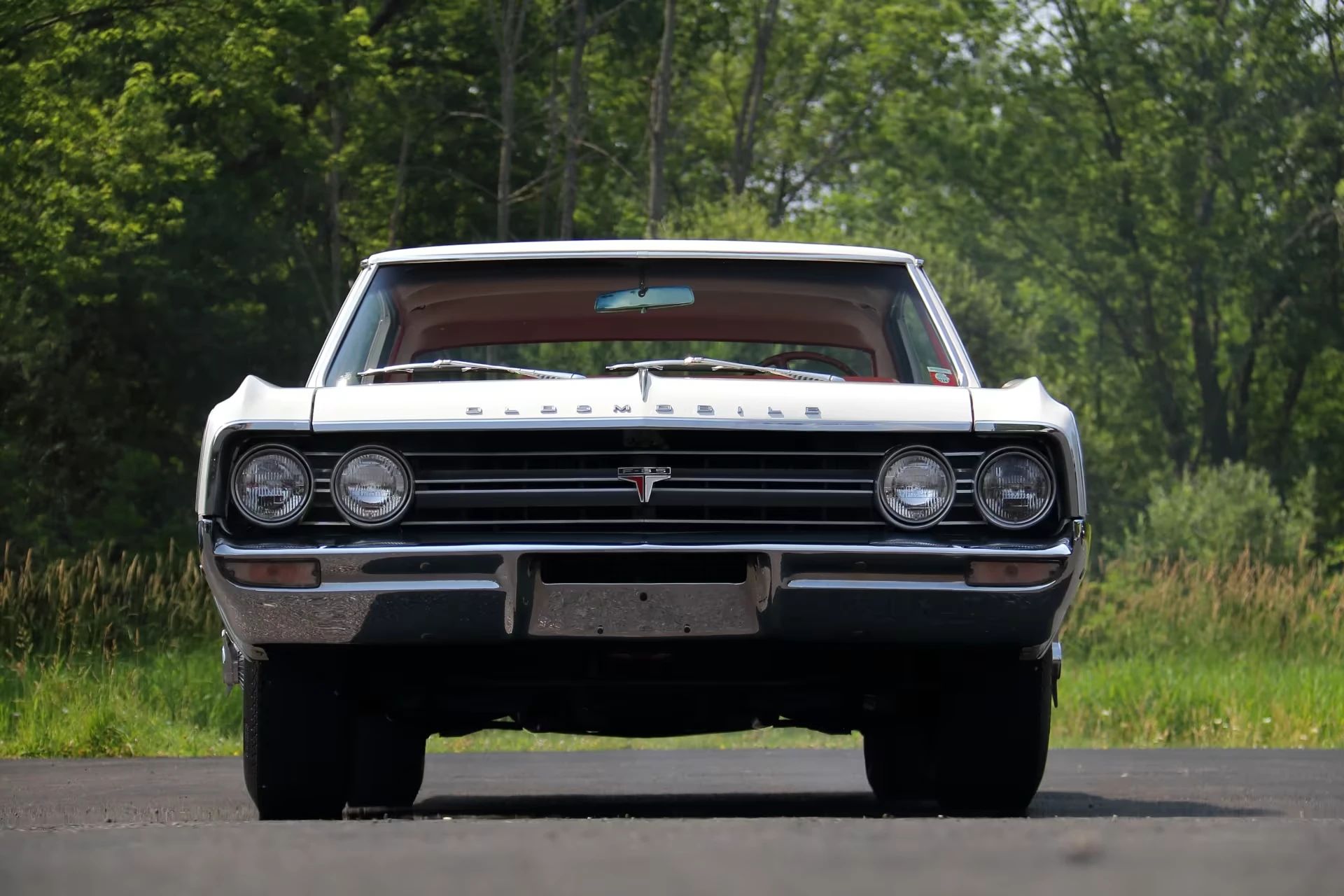 Front view of a 1964 Olds Cutlass, parked outside