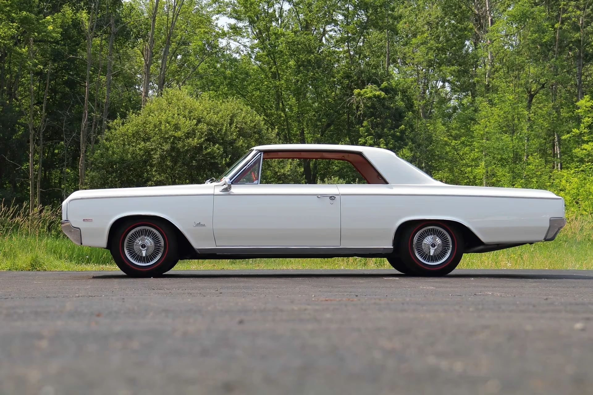 Left side view of a 1964 Olds Cutlass hardtop