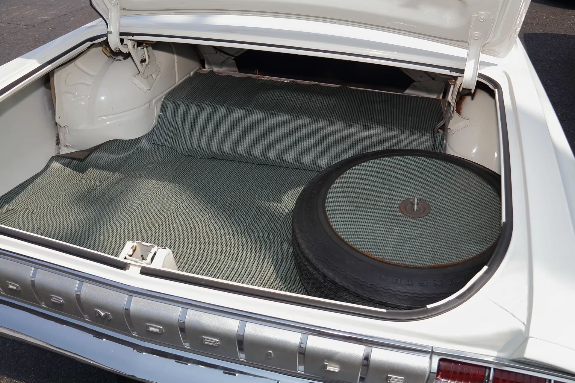 Trunk compartment of a 1964 Olds Cutlass