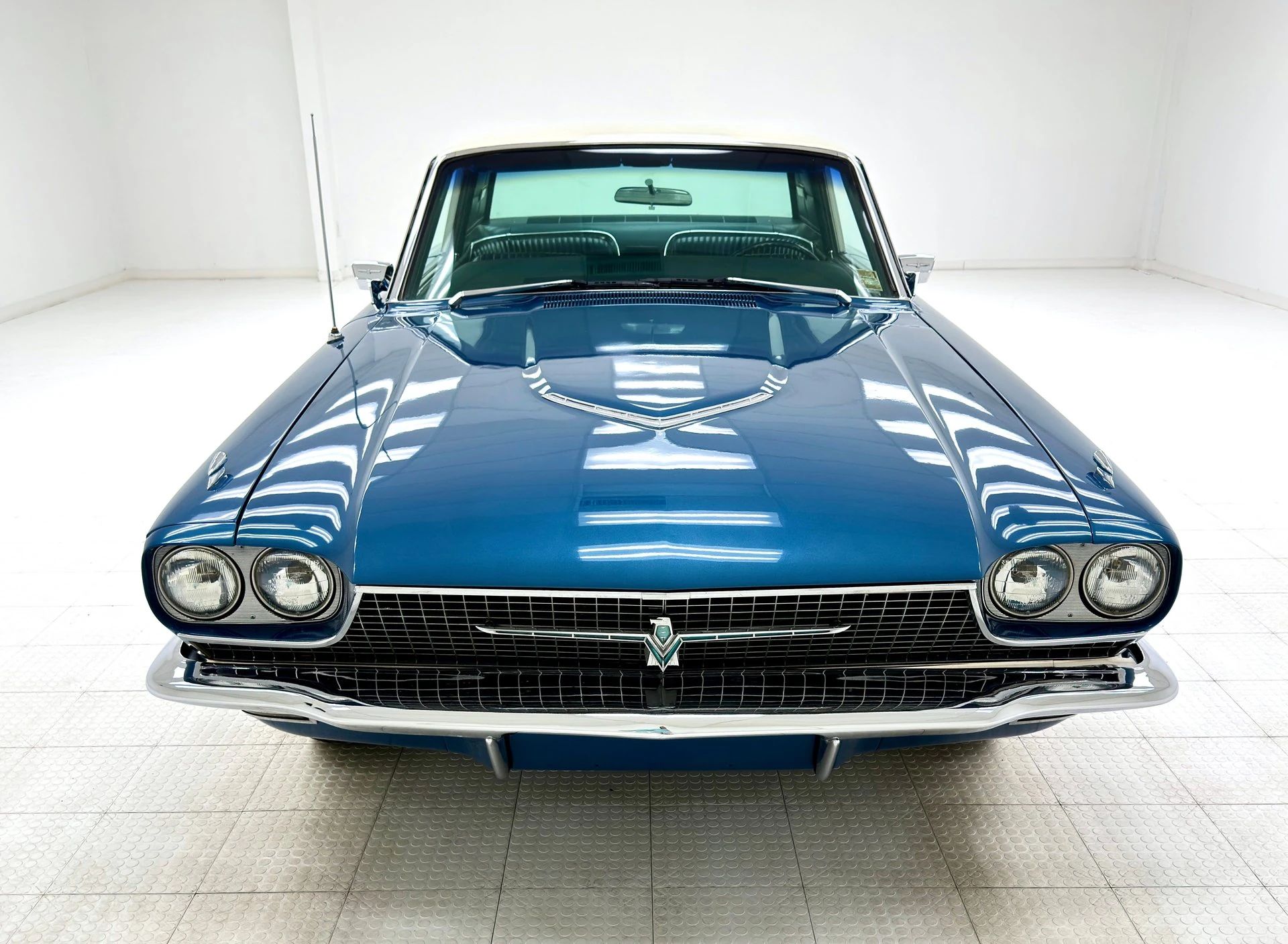 1966 Ford Thunderbird: Dream Car With A Space Age Interior To Let Your Inner Child Take Flight 4 Front view of a 1966 Ford Thunderbird in an interior studio space