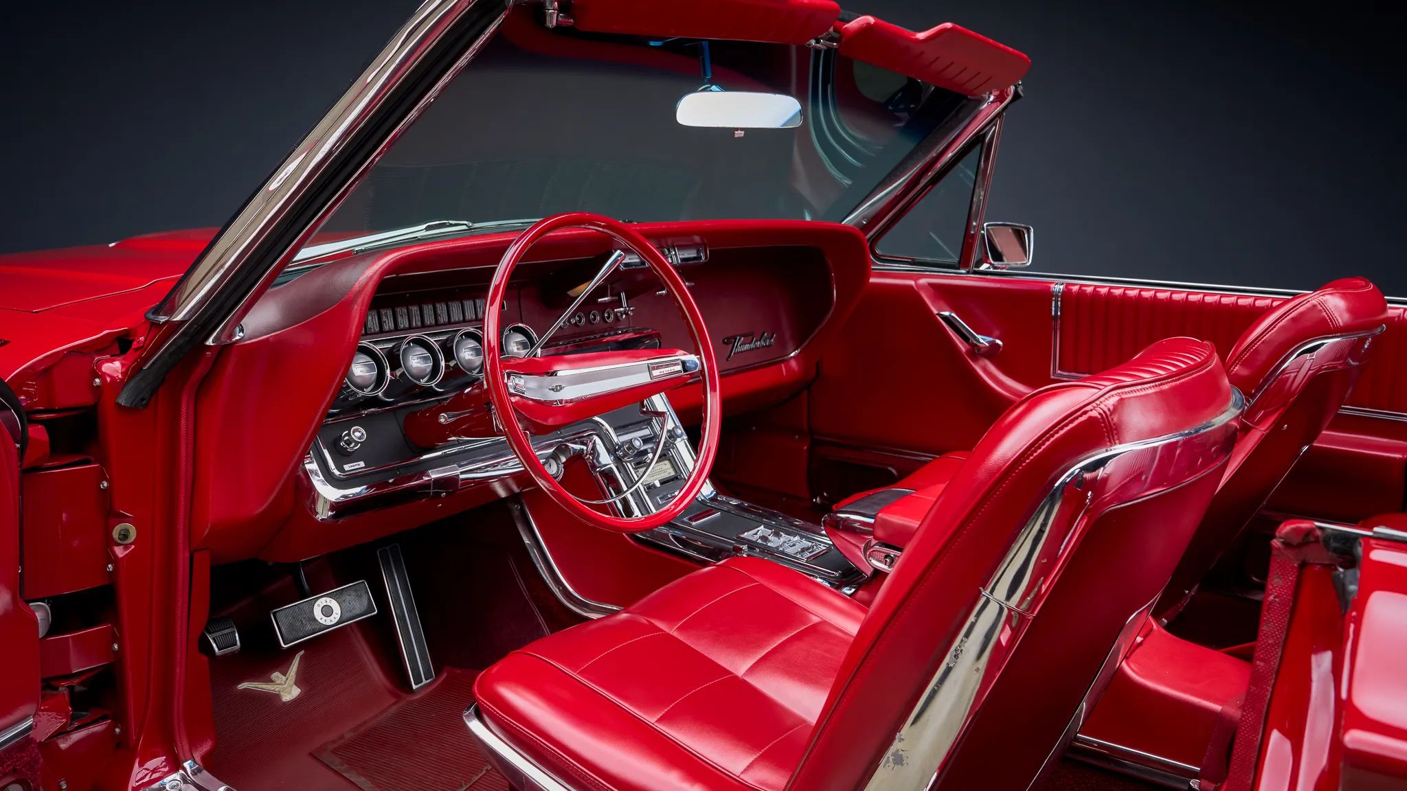 1966 Ford Thunderbird: Dream Car With A Space Age Interior To Let Your Inner Child Take Flight 33 Dashboard and front seats of a 1966 Thunderbird convertible, seen through the open driver's door