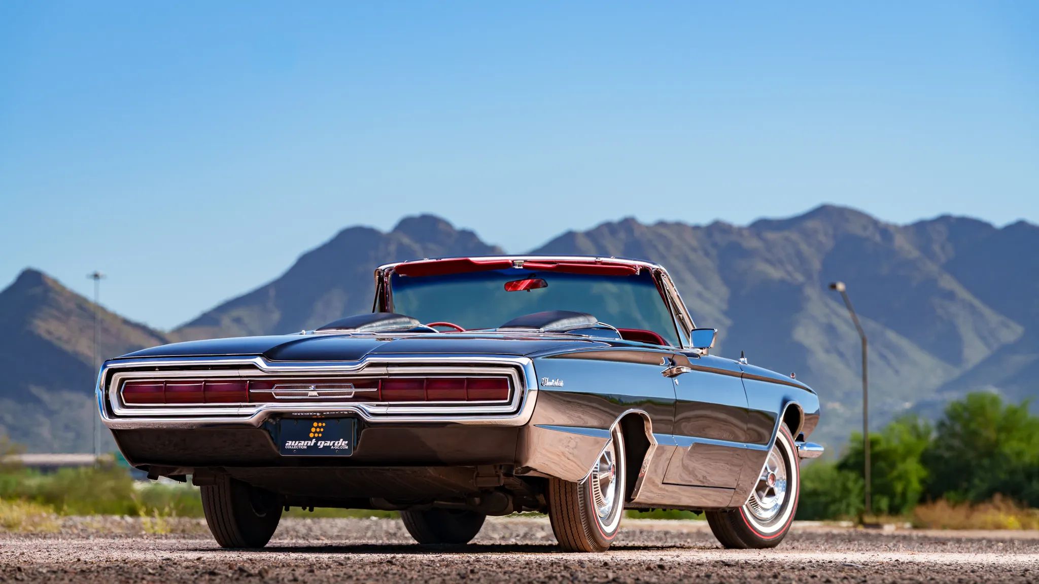 1966 Ford Thunderbird: Dream Car With A Space Age Interior To Let Your Inner Child Take Flight 34 Rear 3q view of a 1966 Ford Thunderbird convertible with mountains in the background