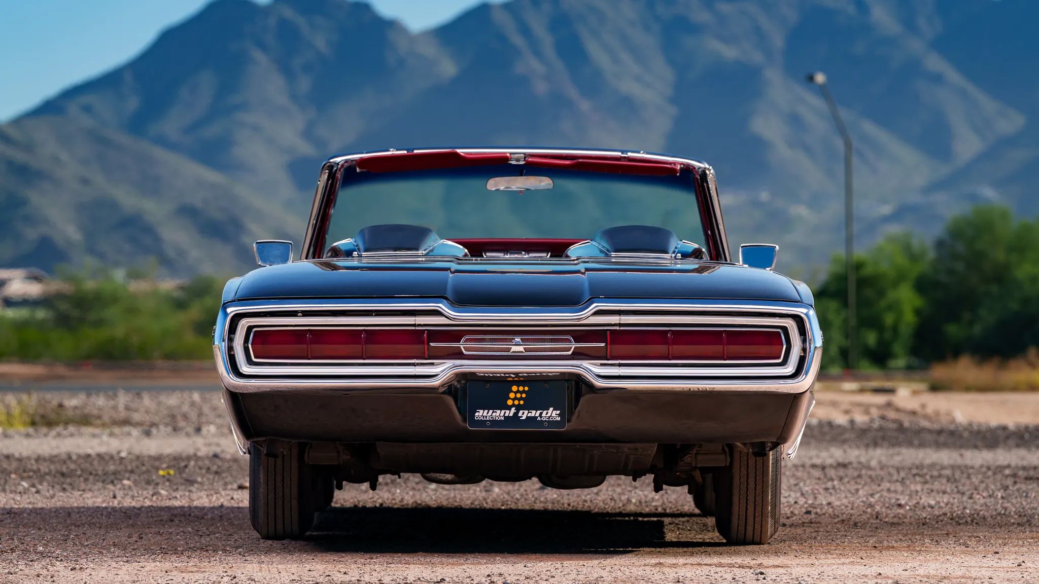 1966 Ford Thunderbird: Dream Car With A Space Age Interior To Let Your Inner Child Take Flight 35 Rear view of a 1966 Ford Thunderbird convertible with mountains in the background