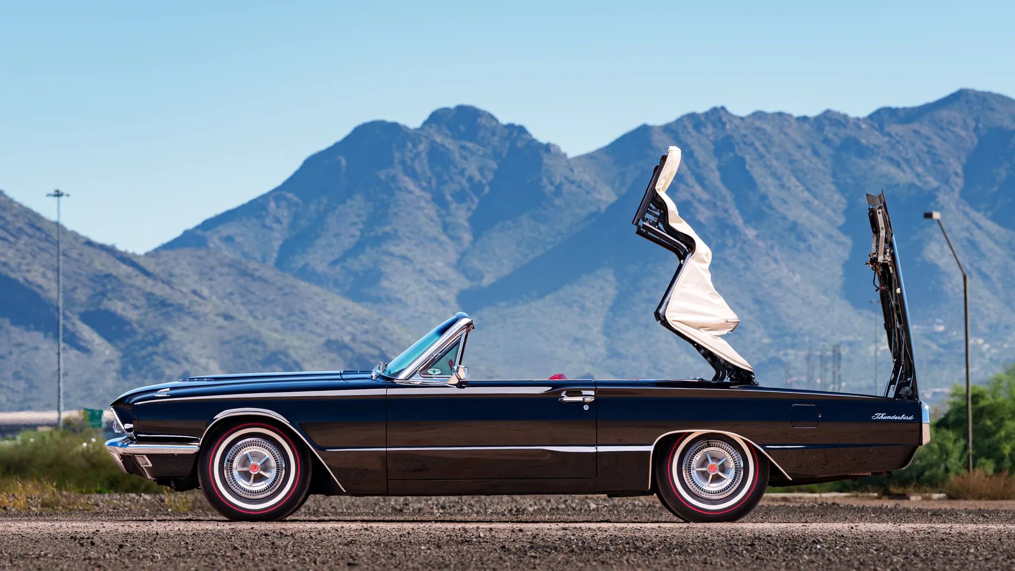 1966 Ford Thunderbird: Dream Car With A Space Age Interior To Let Your Inner Child Take Flight 29 Left side view of a 1966 Ford Thunderbird with the convertible top half-furled