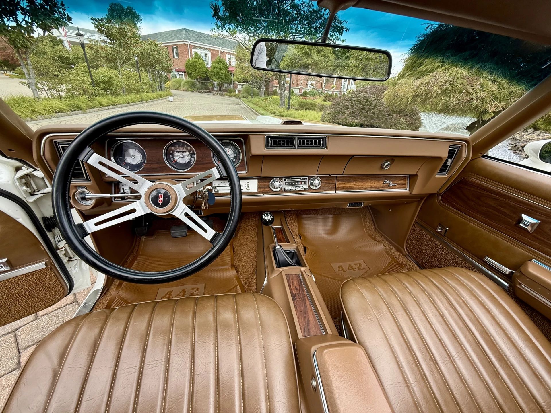 Front seats and dashboard of a 1972 Cutlass, seen from the back seat