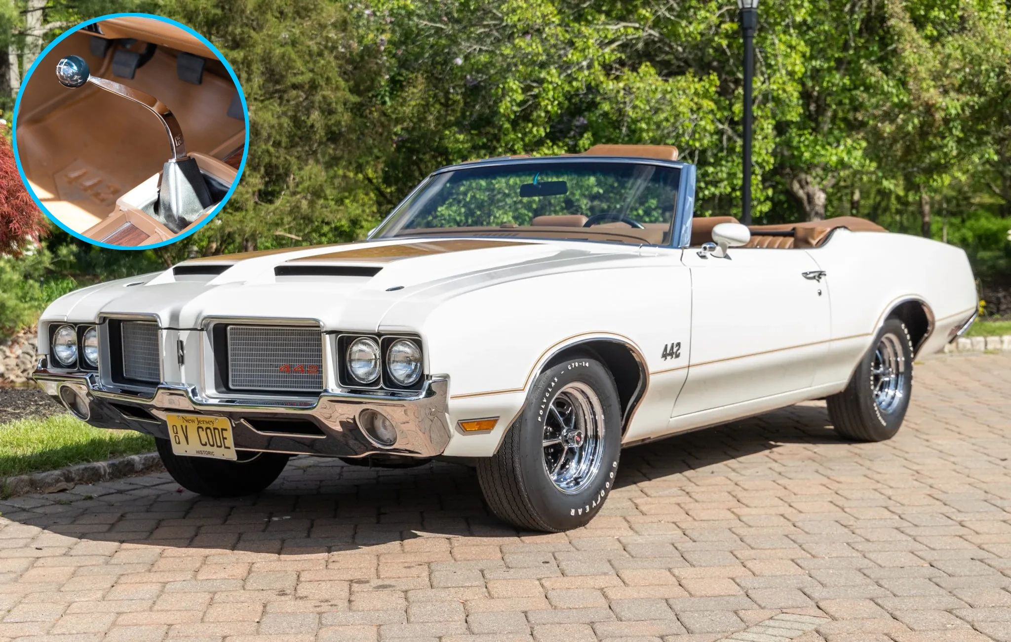 Left front 3q view of a Cameo White 1972 Oldsmobile Cutlass Supreme convertible with hood scoops; an inset in the corner shows the 4-speed shifter
