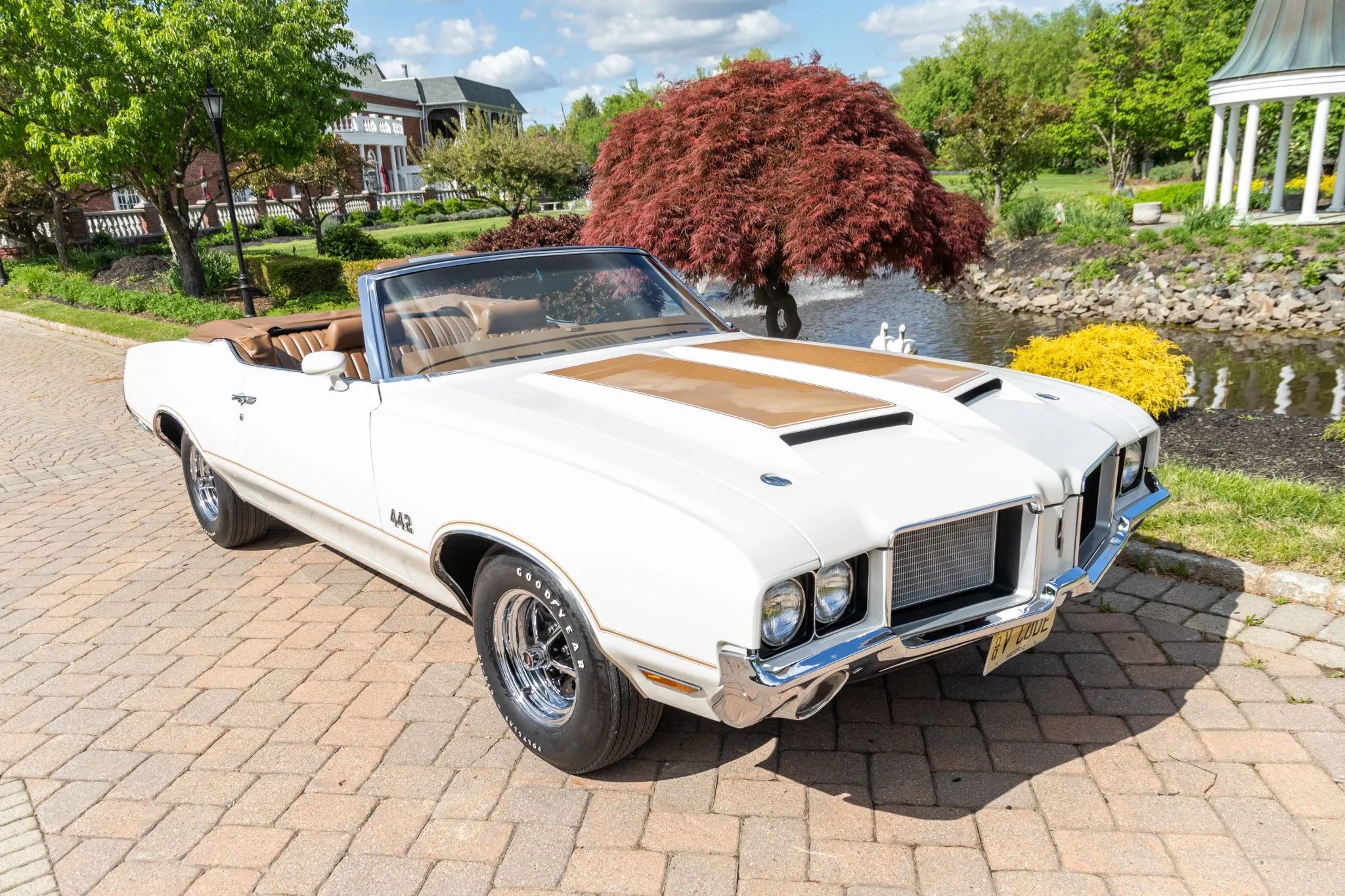Right front 3q view of a 1972 Oldsmobile Cutlass convertible with the top down
