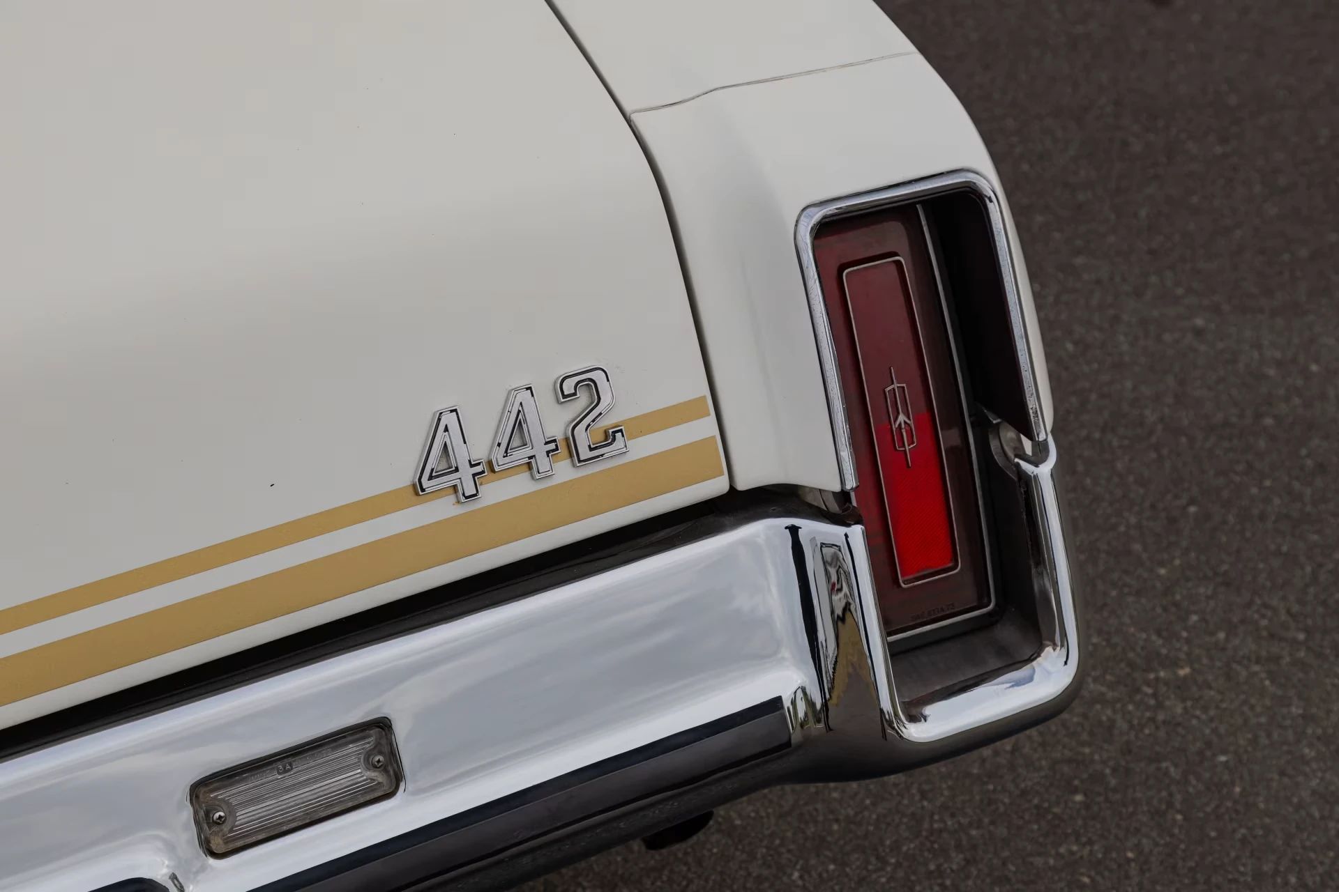 1973 Oldsmobile Cutlass S 4-4-2: What's In A Name (Or A Number?) 5 Right taillight and "4-4-2" badge of a 1973 Oldsmobile Cutlass with stripes