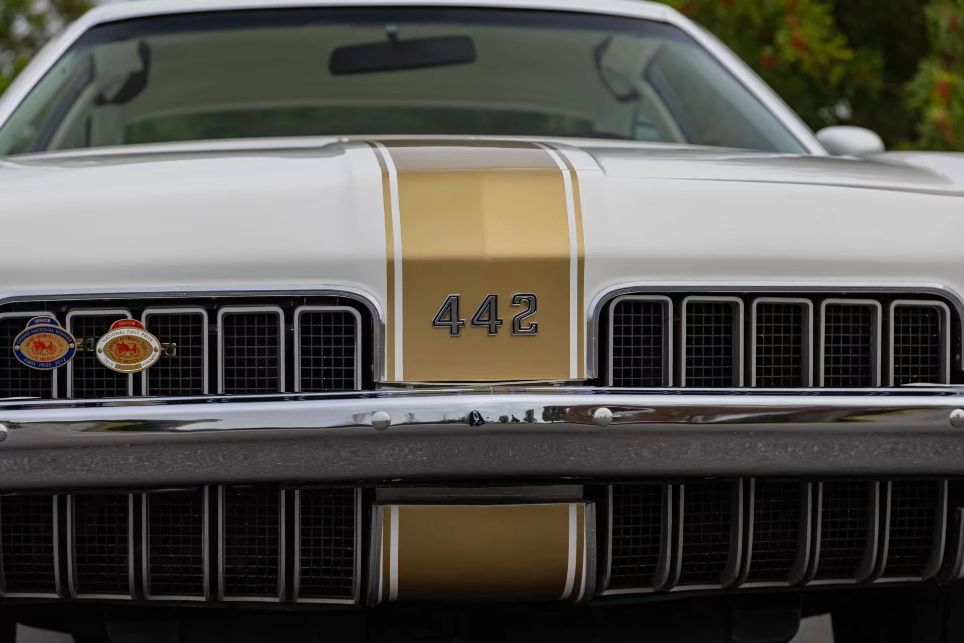 1973 Oldsmobile Cutlass S 4-4-2: What's In A Name (Or A Number?) 2 Closeup of the "442" badge on the nose of a 1973 Oldsmobile Cutlass with prominent stripes