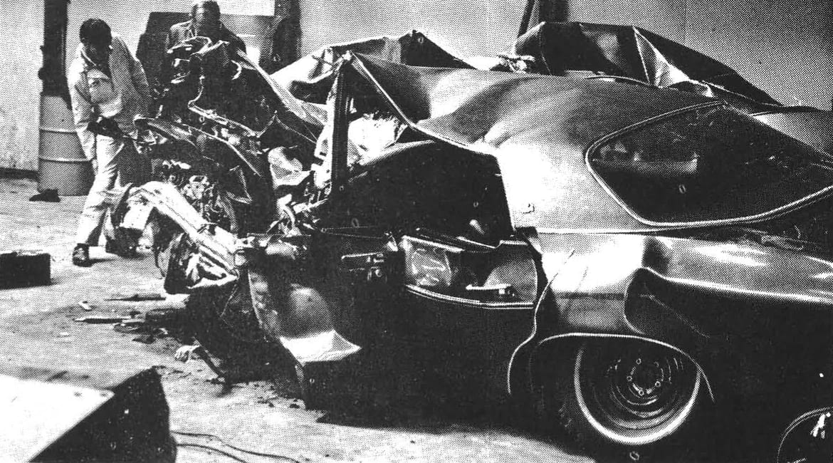 B&W photo of a badly damages 1974 Oldsmobile Delta 88