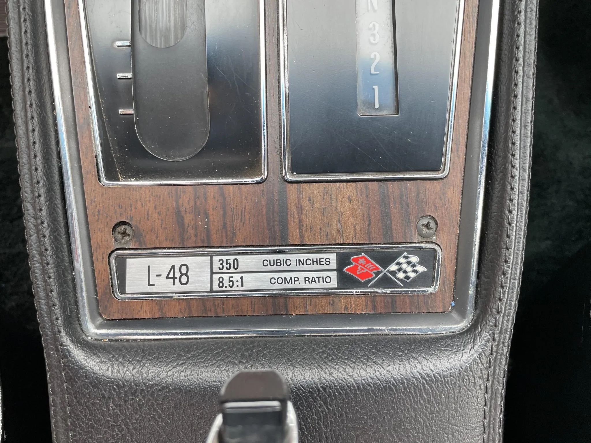 1975 Chevrolet Corvette L48 Convertible: Only 165 HP And Just 61 Miles On This Final-Year C3 Convertible 8 Corvette console badge reading "L-48 350 Cubic Inches 8.5:1 comp. ratio"