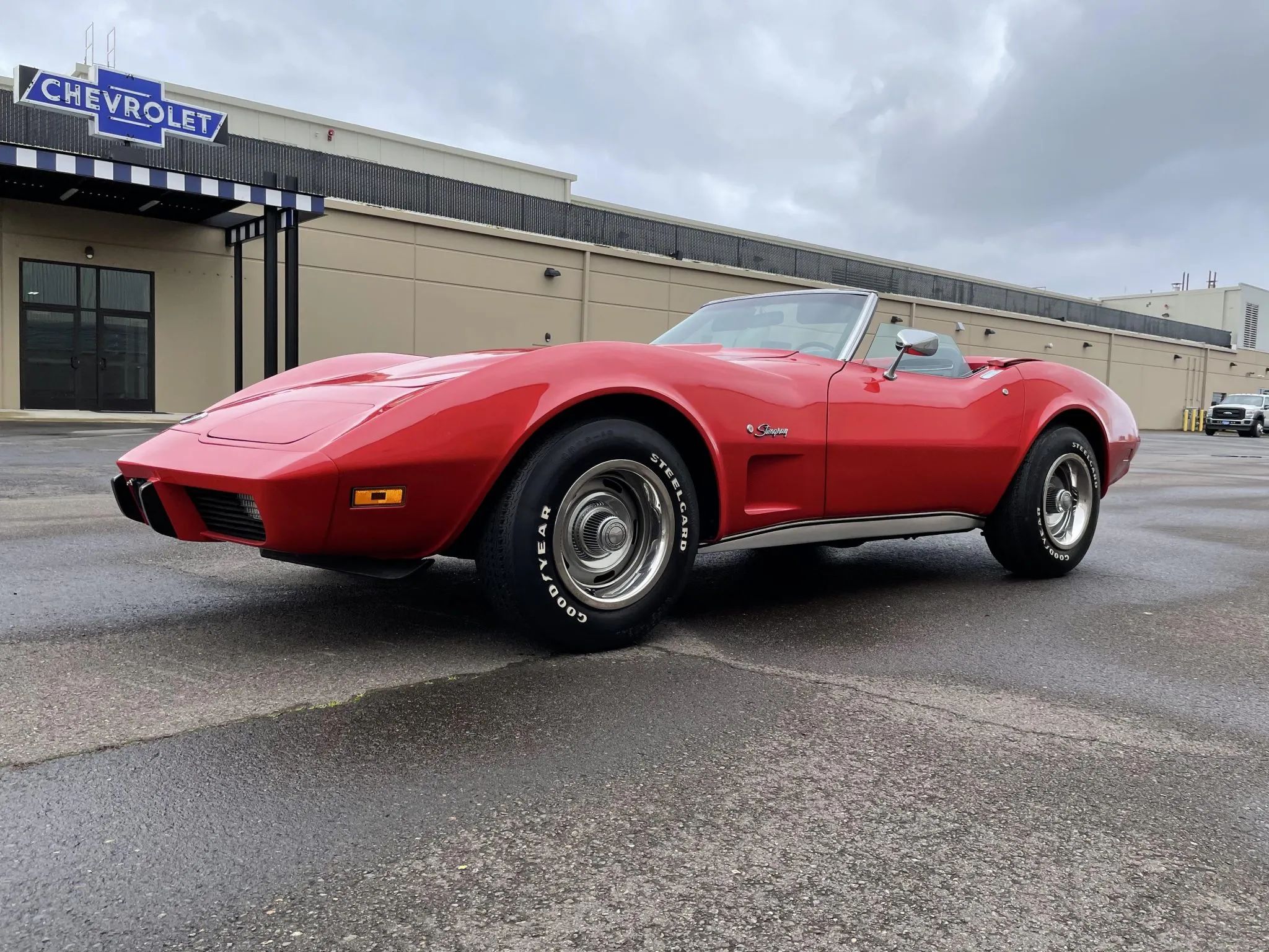 1975 Chevrolet Corvette L48 Convertible: Only 165 HP And Just 61 Miles On This Final-Year C3 Convertible 10 Low-angle right front 3q view of a Mille Miglia Red 1975 Corvette convertible with the top down