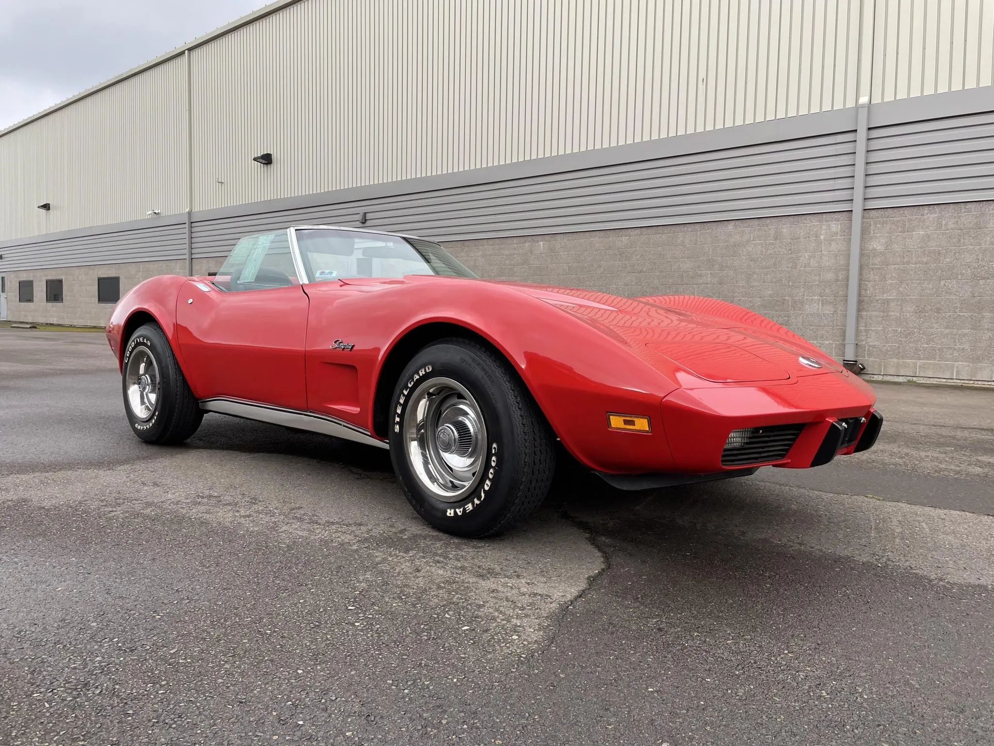 1975 Chevrolet Corvette L48 Convertible: Only 165 HP And Just 61 Miles On This Final-Year C3 Convertible 17 Low-angle right front 3q view of a Mille Miglia Red 1975 Corvette convertible with the top down