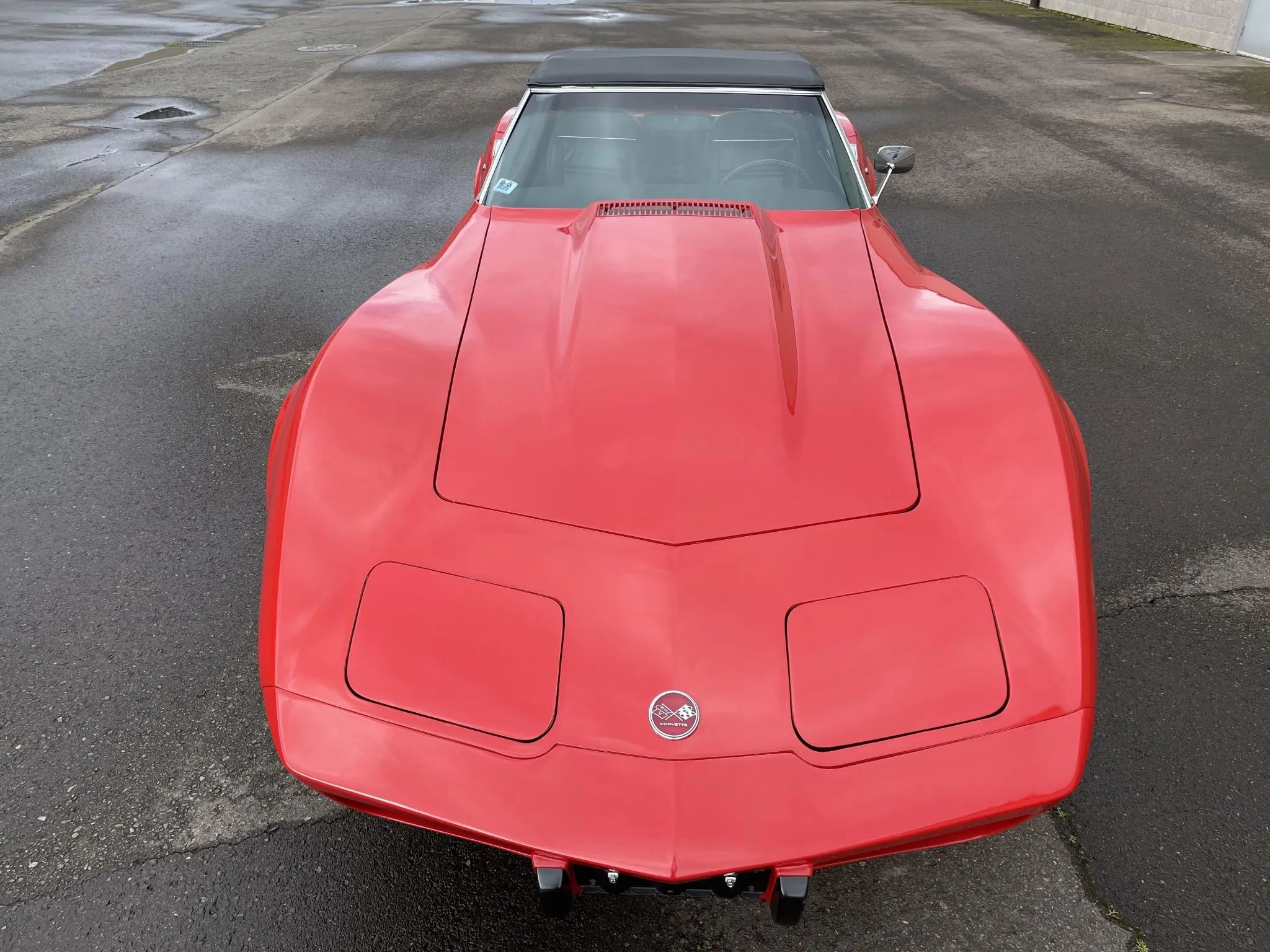1975 Chevrolet Corvette L48 Convertible: Only 165 HP And Just 61 Miles On This Final-Year C3 Convertible 14 High angle front view of a Mille Miglia Red 1975 Corvette convertible with the top up