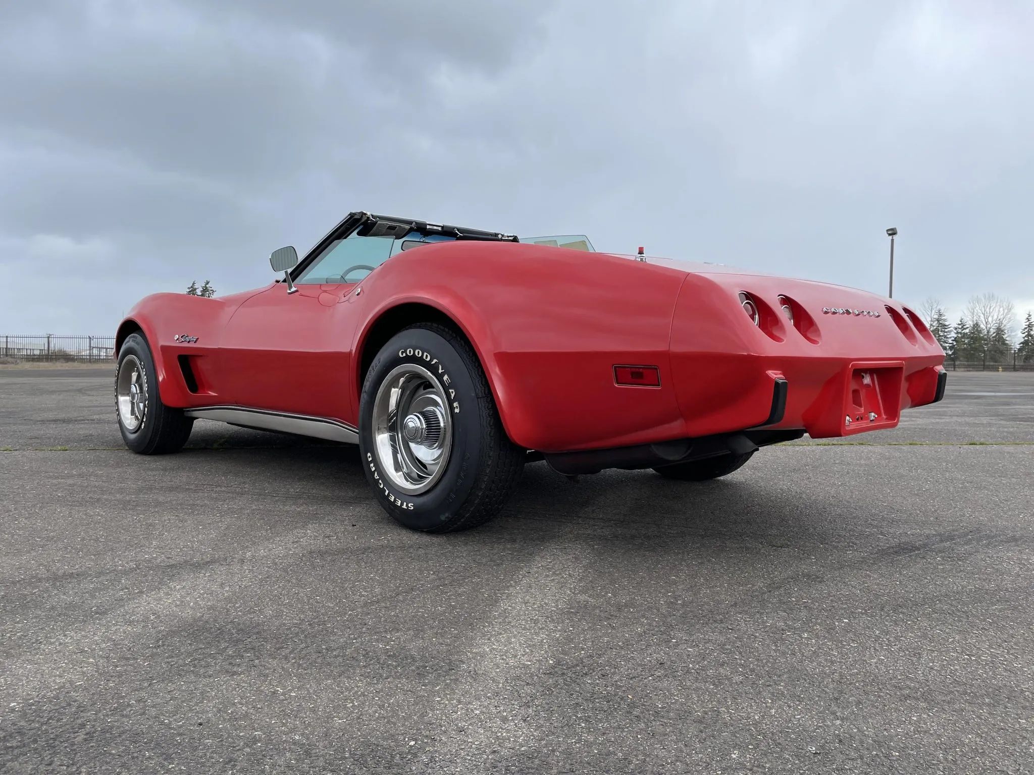 1975 Chevrolet Corvette L48 Convertible: Only 165 HP And Just 61 Miles On This Final-Year C3 Convertible 12 Low-angle left rear 3q view of a Mille Miglia Red 1975 Corvete convertible with the top down