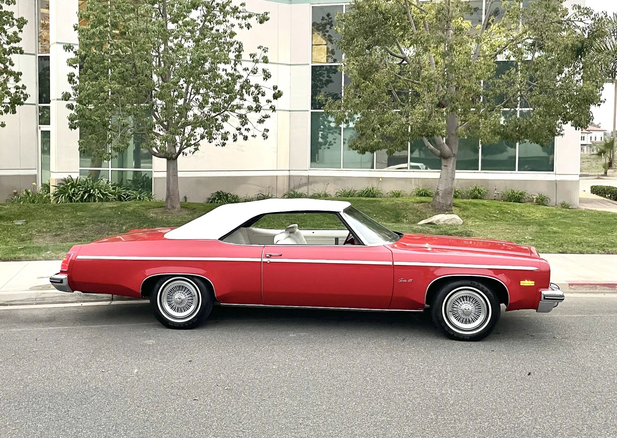 Right side view of a 1975 Oldsmobile B-body convertible with the top up