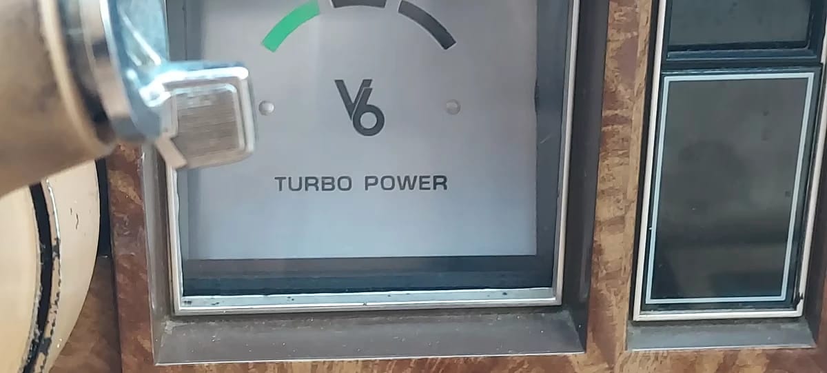 Close-up of the square "V6 Turbo Power" indicator on a 1978 Buick Regal