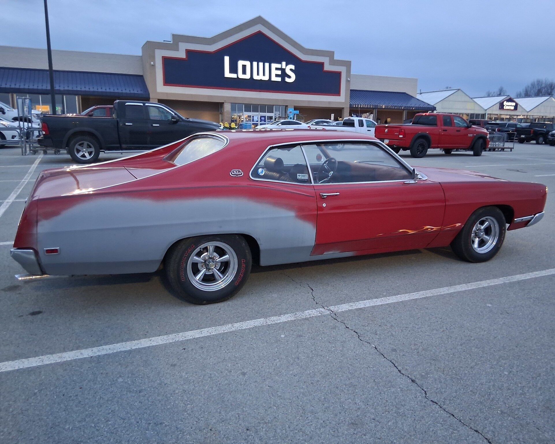 Side view of 1969 Ford XL in red and gray primer