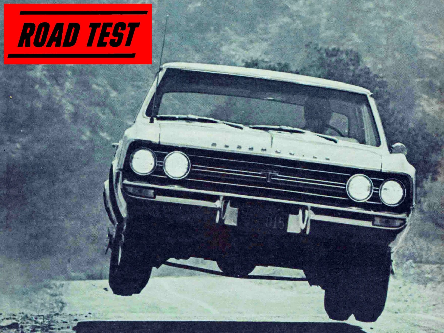 Blue-tinted B&W photo of a 1964 Oldsmobile Cutlass 442 catching air on a mountain road, with an inset red box reading "Road Test"