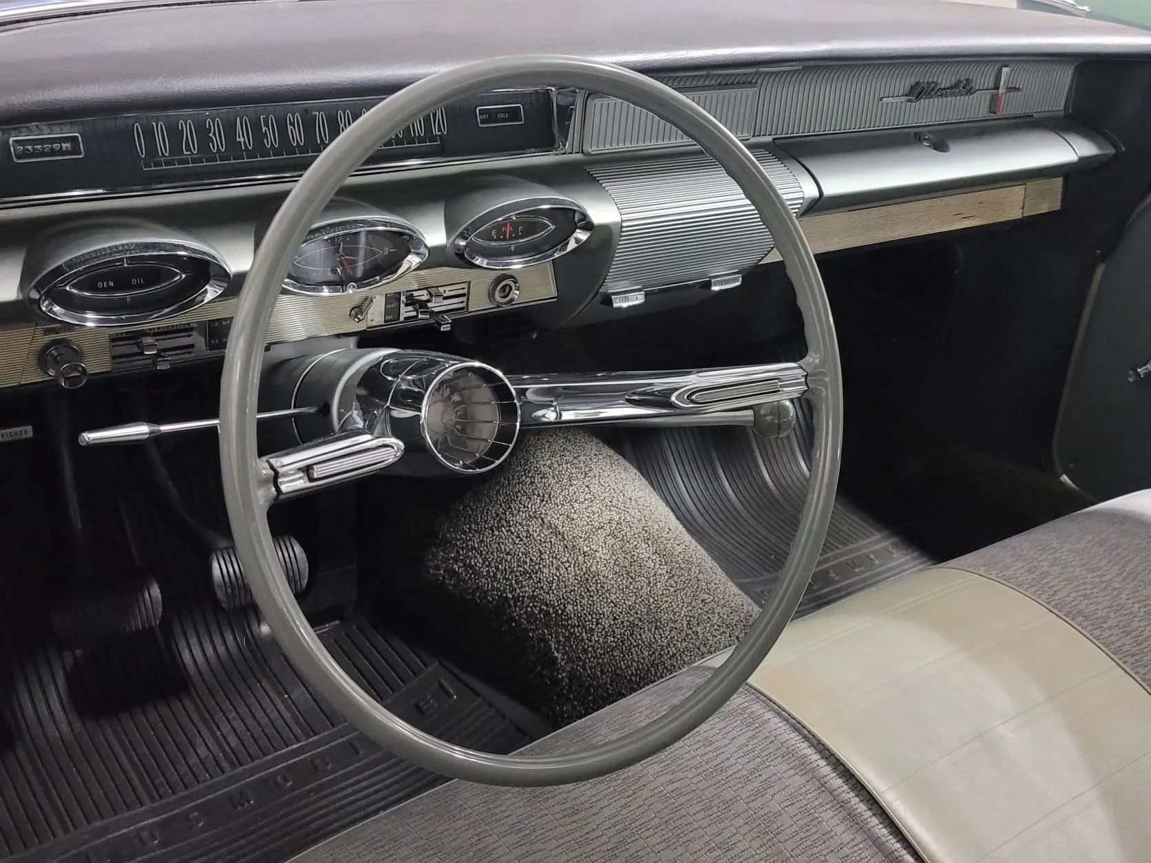 Dashboard of a 1961 Oldsmobile Dynamic 88 with radio delete plates